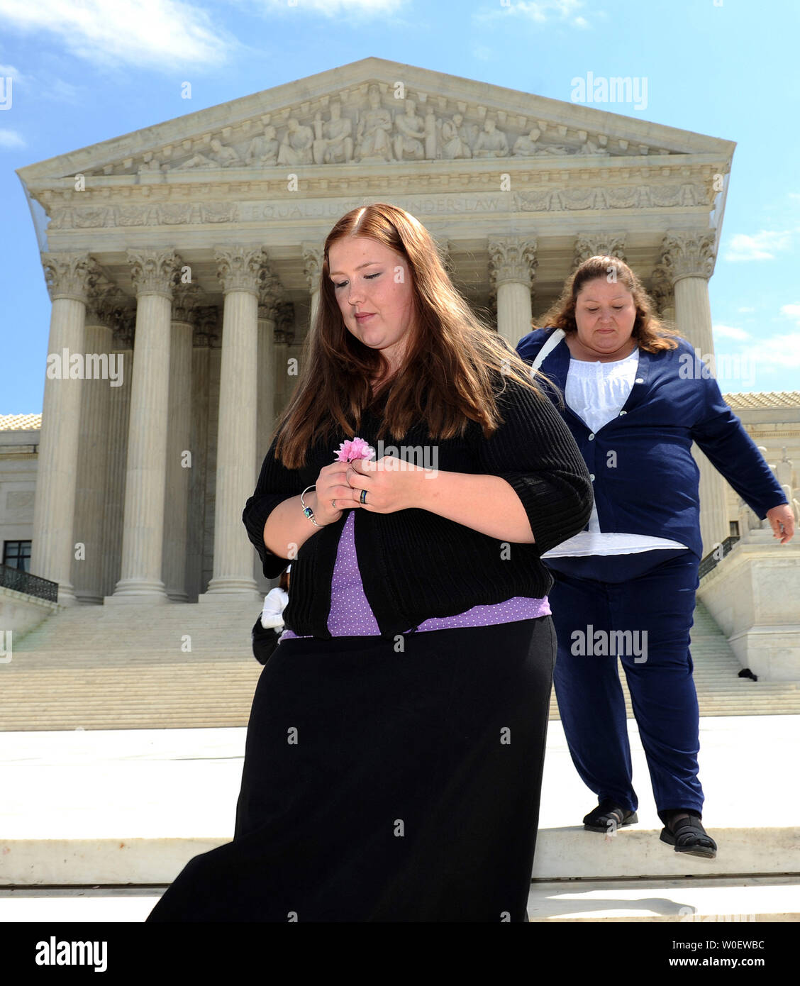 Savana Redding, age 19, is seen in front of the Supreme Court after oral arguments were made in her case in Washington on April 21, 2009. At right is her mother April. Redding, age 13 at the time, was strip searched at her Arizona school after another student accused her of giving out prescription-strength ibuprofen, the equivalent of two over-the-counter Advils, when she was in eighth grade. No pills were found. The Supreme Court will decide whether the strip search was an invasion of privacy and a violation of the Fourth Amendment.     (UPI Photo/Roger L. Wollenberg) Stock Photo