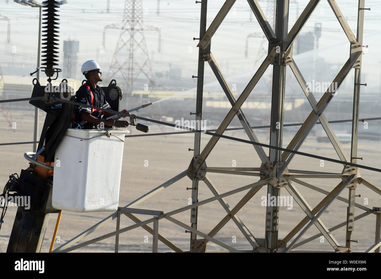 Kuwait City, Kuwait. 26th June, 2019. An electrical engineer works on