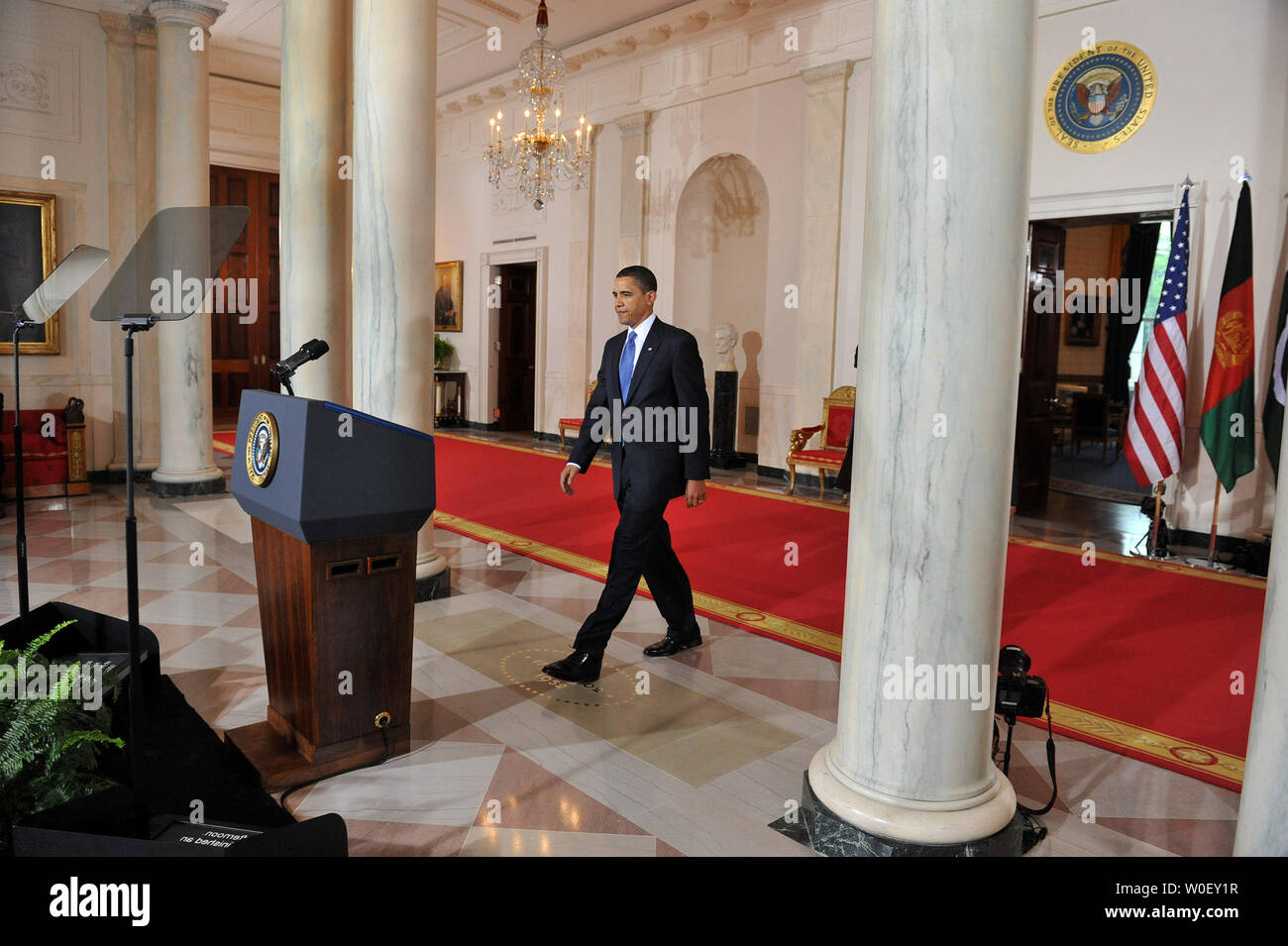 U.S. President Barack Obama walks to the podium to deliver remarks after meeting with Pakistan President Asif Ali Zardari and Afghanistan President Hamid Karzai in the Grad Foyer at the White House in Washington on May 6, 2009. (UPI Photo/Kevin Dietsch) Stock Photo