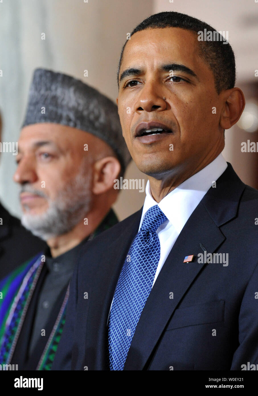U.S. President Barack Obama (R) delivers remarks alongside Afghanistan President Hamid Karzai following a meeting with him and Pakistan President Asif Ali Zardari (not pictured), in the Grad Foyer at the White House in Washington on May 6, 2009. (UPI Photo/Kevin Dietsch) Stock Photo