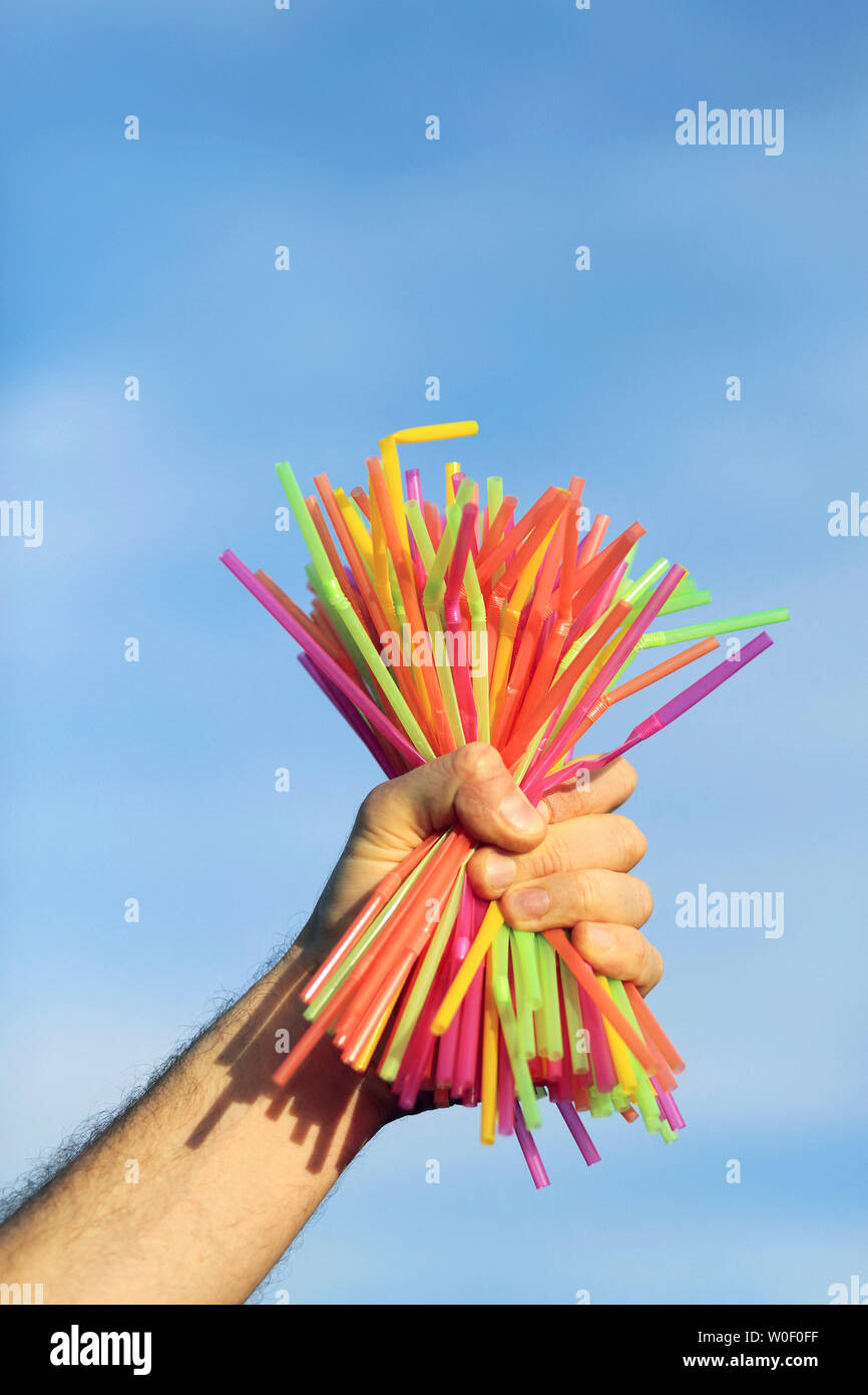 Hand holding plastic straws Stock Photo Alamy