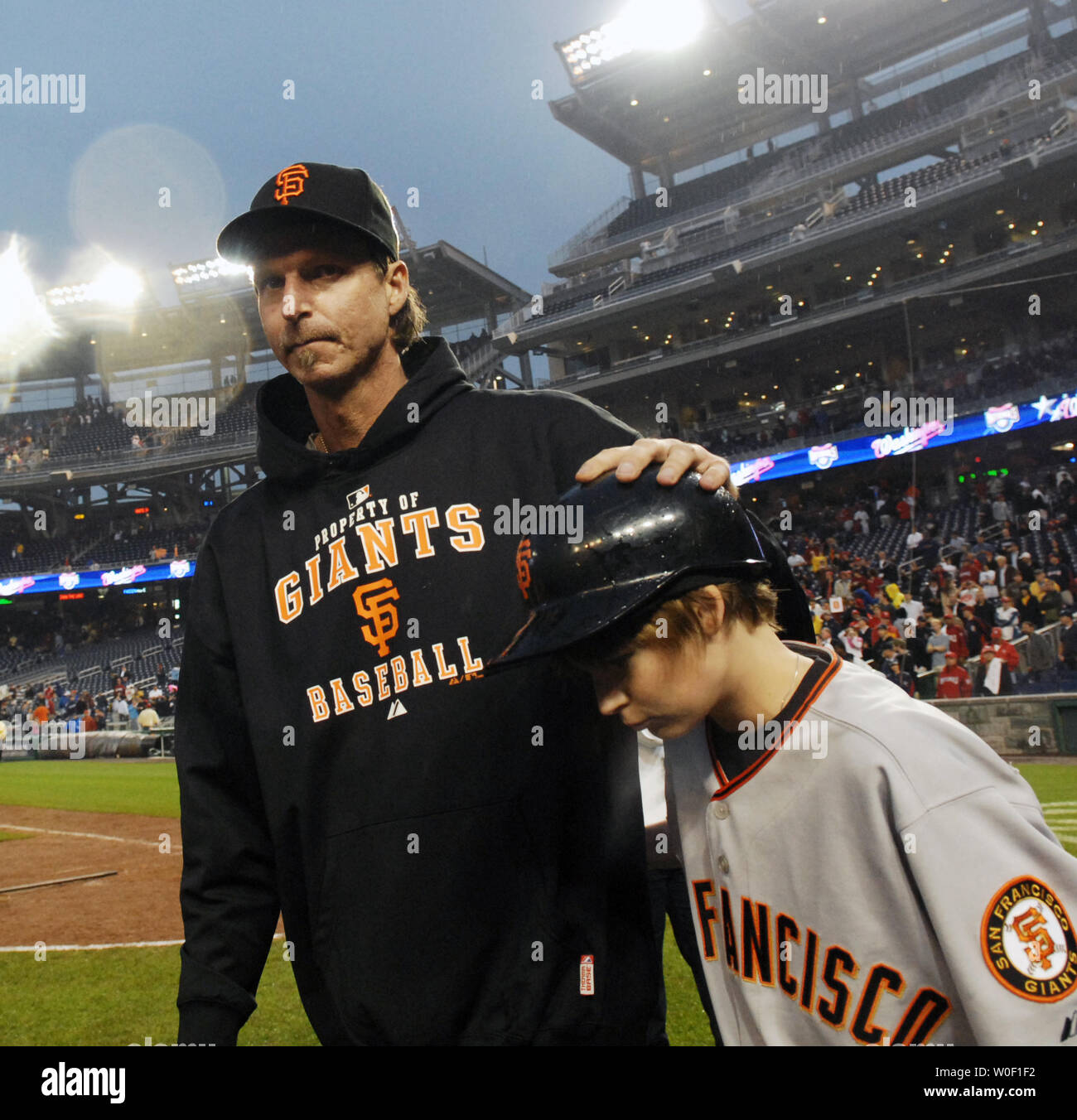 San Francisco Giants pitcher Randy Johnson greets his son, Tanner, after he  achieved his 300th career win after the game against the Washington  Nationals at Nationals Park in Washington on June 4