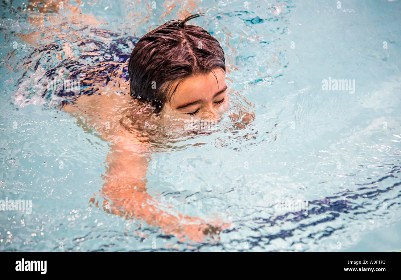 Little boy in a swimming pool, head under the water Stock Photo