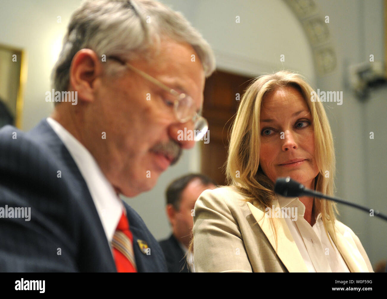 Bo Derek (R), actress and board member of WildAid, watches as Rowan Gould, acting Fish and Wildlife Service Director, testifies during a House Natural Resources Insular Affairs, Oceans and Wildlife Subcommittee hearing on H.R.3086, the 'Global Wildlife Conservation, Coordination, and Enhancement Act of 2009' in Washington on July 28, 2009. (UPI Photo/Kevin Dietsch) Stock Photo
