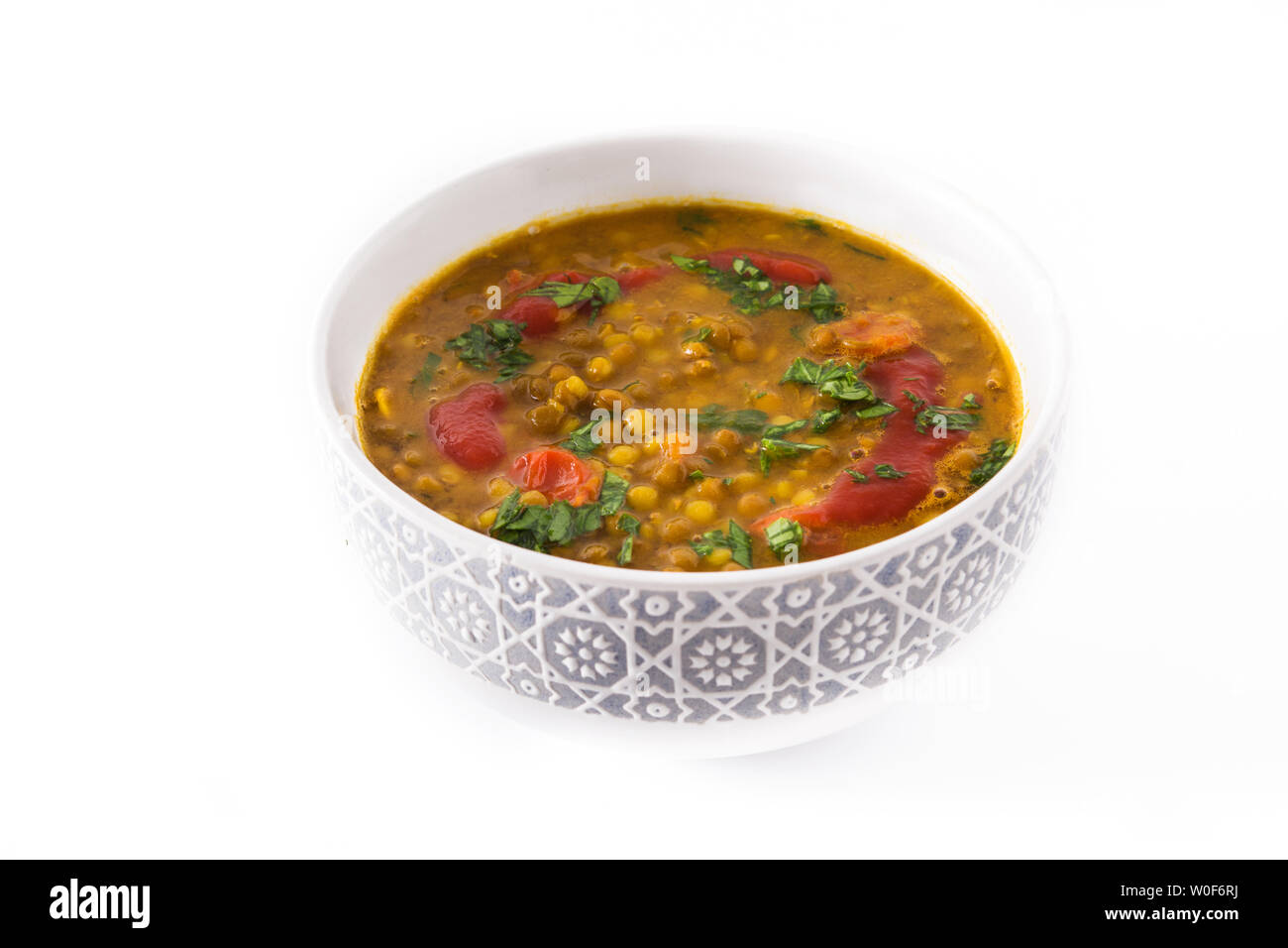 Indian lentil soup dal (dhal) in a bowl isolated on white background Stock Photo