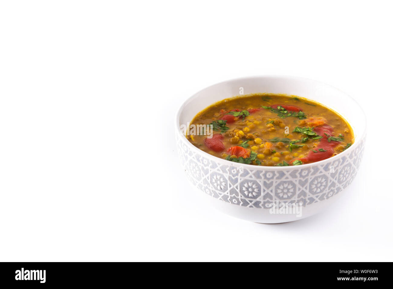 Indian lentil soup dal (dhal) in a bowl isolated on white background. Top view Stock Photo