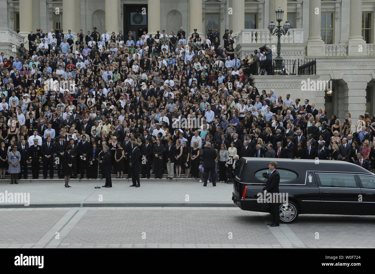 Rep. Patrick Kennedy (D-RI) (R) stands by the hearse carrying the remains of U.S. Senator Edward Kennedy as Reverend Daniel P. Coughlin, Chaplain of the U.S. House of Representatives, says a prayer while widow Vicki Kennedy (L) and members of Congress and former and current staff members of the Senator listen, outside the U.S. Capitol building in Washington on August 29, 2009. Senator Kennedy, who passed away August 25 at the age of 77, will be buried  today at Arlington National Cemetery. UPI/Alexis C. Glenn Stock Photo