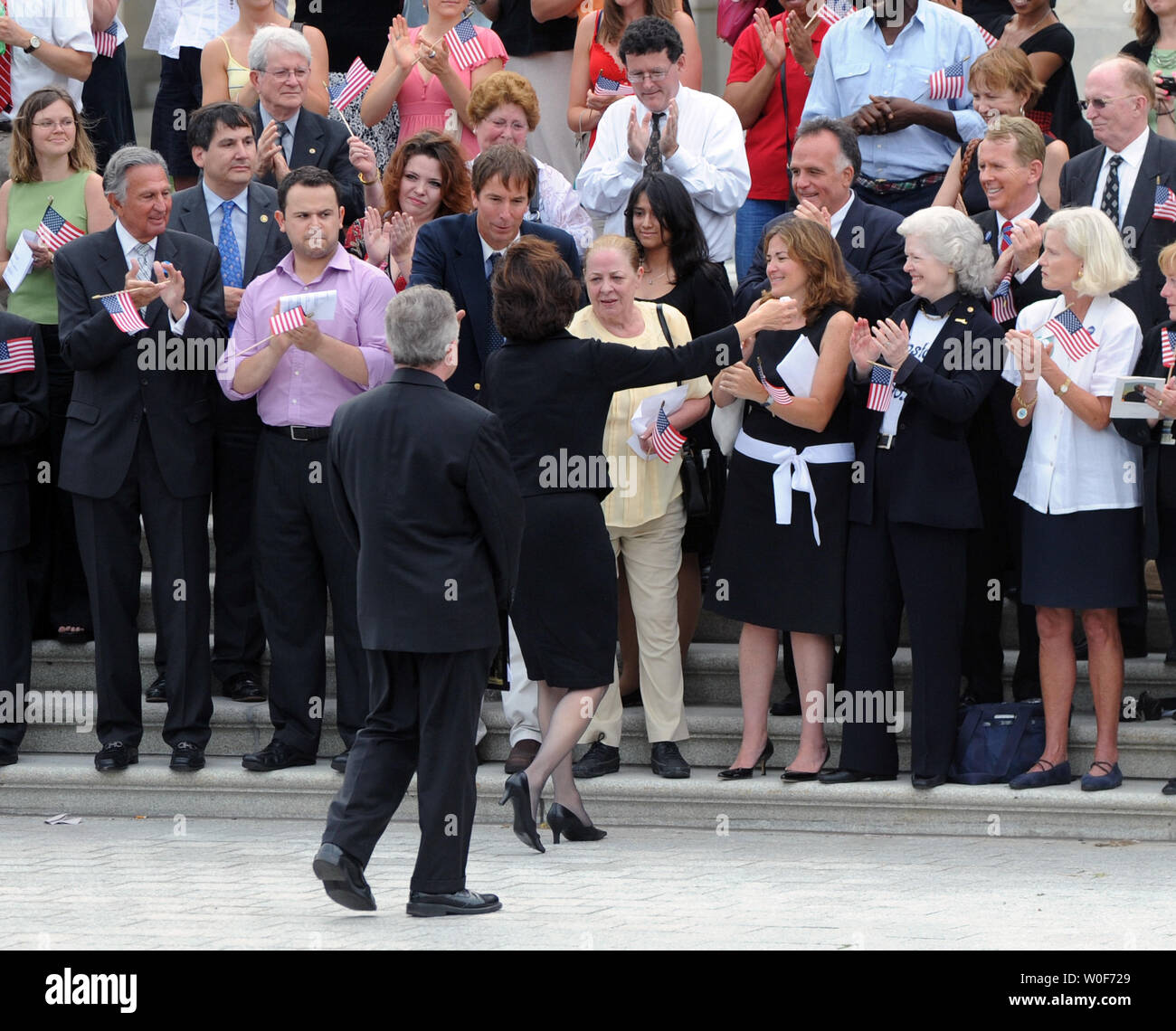 Vicki Kennedy, widow of Senator Edward Kennedy, walks up to greet members of Congress and former and current staff members of the Senator, as Reverend Daniel P. Coughlin, Chaplain of the U.S. House of Representatives, (L) stands by, outside the U.S. Capitol building in Washington on August 29, 2009. Senator Kennedy, who passed away August 25 at the age of 77, will be buried  today at Arlington National Cemetery. UPI/Alexis C. Glenn Stock Photo