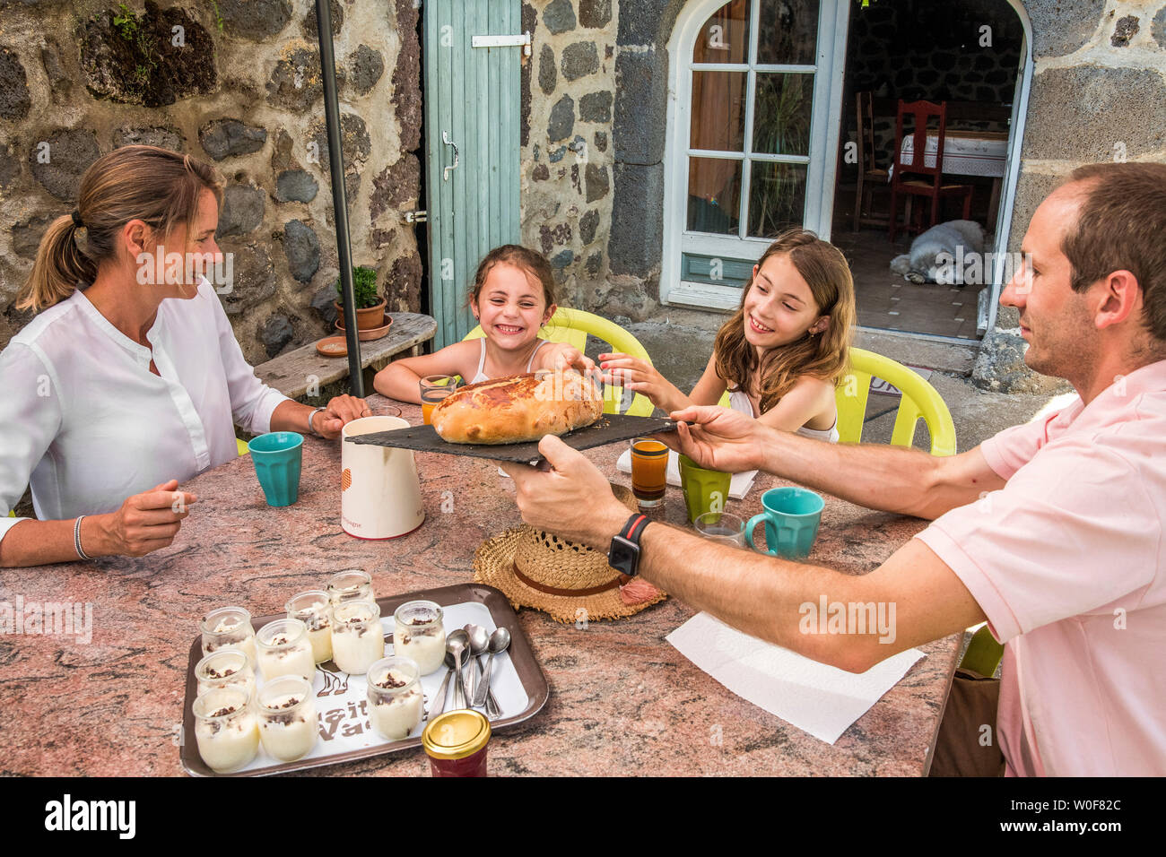 Auvergne - Rhone-Alpes - Haute-Loire - Family trip to the farm. Family tasting the good products of the farm. Stock Photo