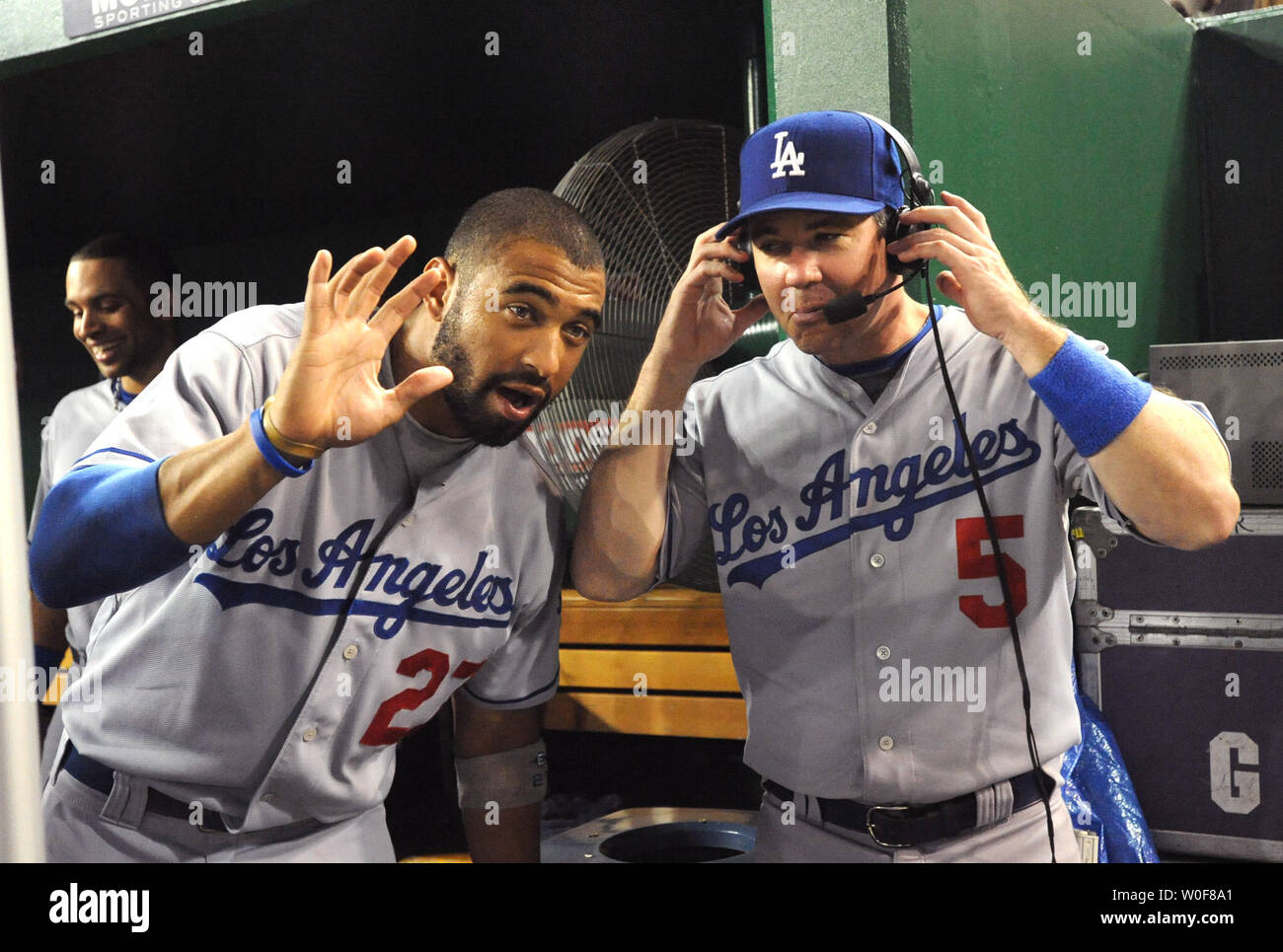 Dodgers centerfielder Matt Kemp (L) hams it up for the camera and says 'Hi Mom' as Dodgers Mark Loretta is interviewed by TV between innings of the Washington Nationals and Los Angeles Dodgers game in Washington on September 23, 2009.    UPI/Pat Benic Stock Photo