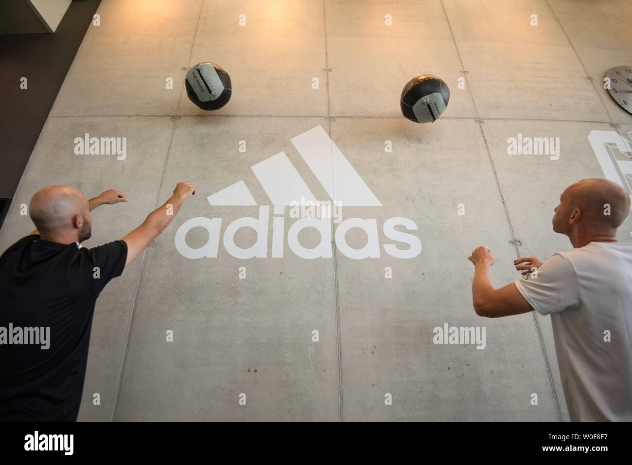 Herzogenaurach, Germany. 26th June, 2019. Two Adidas employees use the gym  for a workout. In the 70th year of its existence, the sporting goods  manufacturer moved into the new campus and the