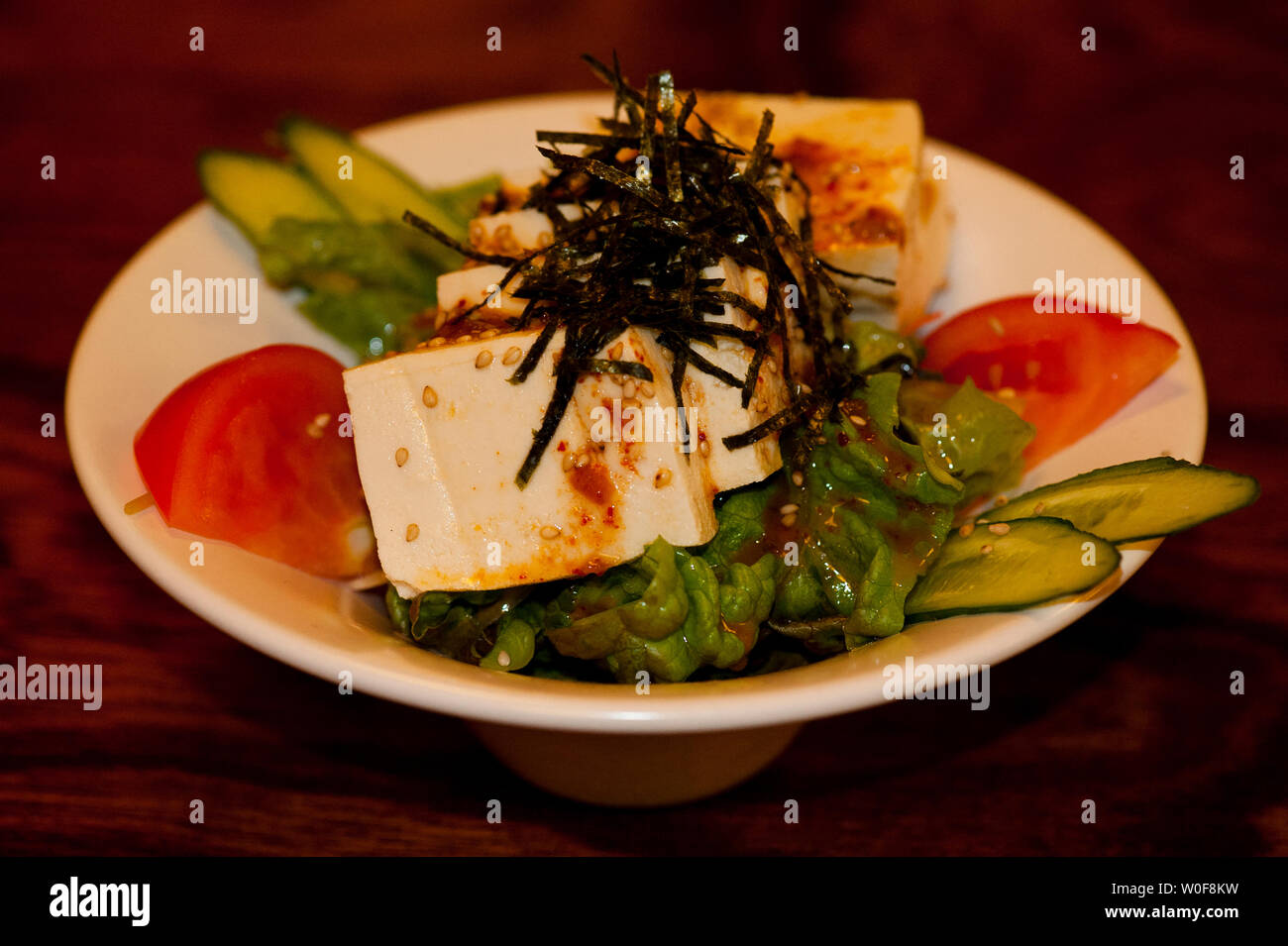 Tofu based dish along with raw vegetables and  alguae, Kawaguchiko, Japan Stock Photo