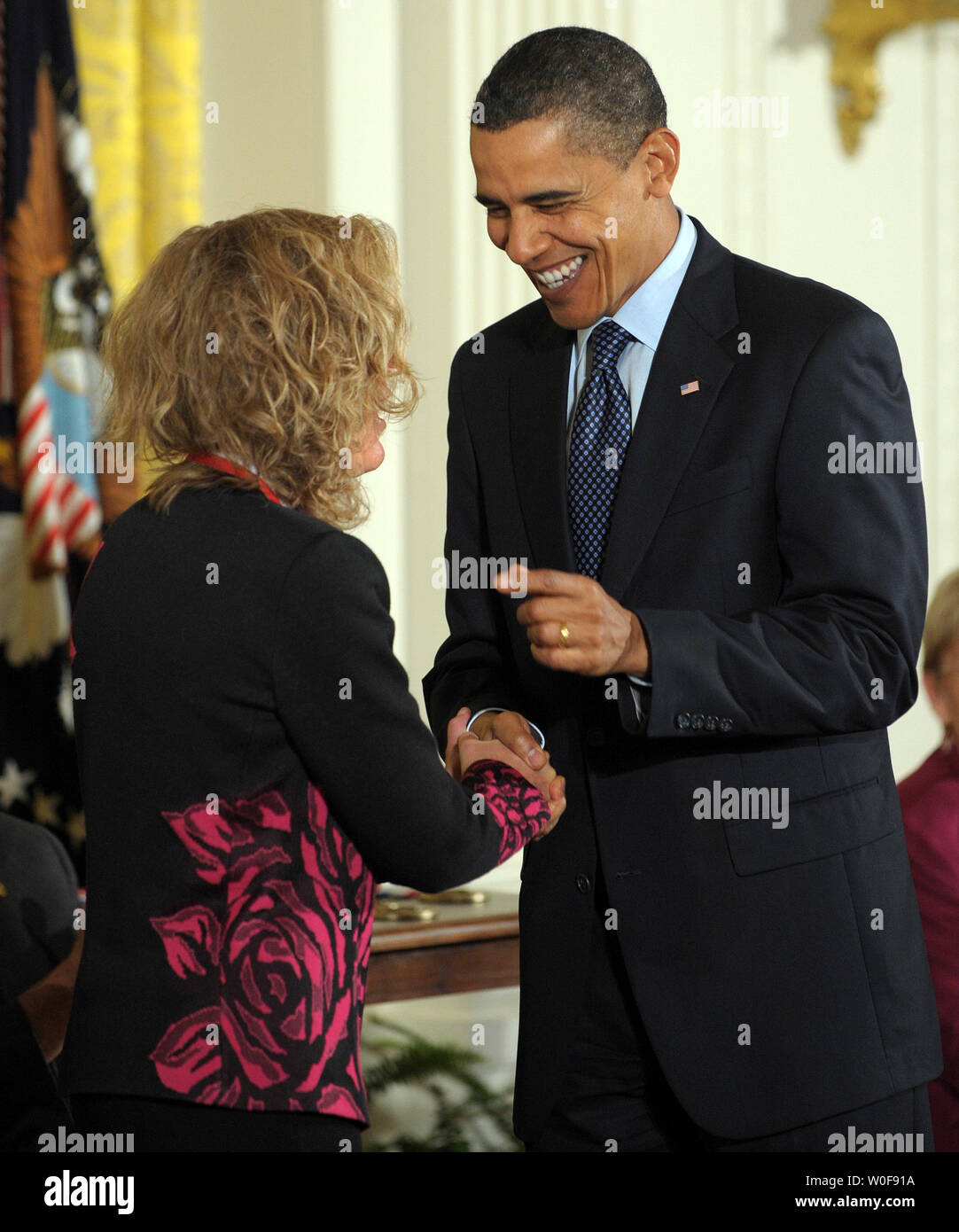 U.S. President Barack Obama awards Dr. Elaine Fuchs a National Medal of Science in the East Room of the White House in Washington on October 7, 2009. Fuchs was honored for 'her pioneering use of cell biology and molecular genetics in mice to understand the basis of inherited diseases in humans and her outstanding contributions to our understandings of the biology of skin and its disorders, including her notable investigations of adult skin stem cells, cancers, and genetic syndromes.'   UPI/Roger L. Wollenberg Stock Photo
