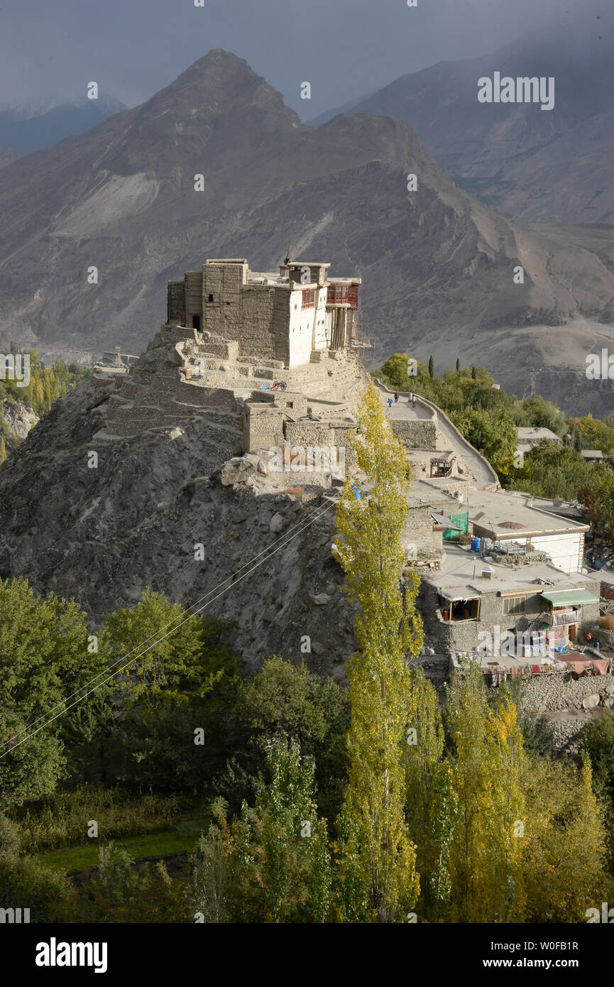 Pakistan, Gilgit Baltistan, Karimabad City, Hunza Valley, View of Karimabad City and Baltit Fort of 13th Century Tibetan Architecture Overlooking the City Stock Photo