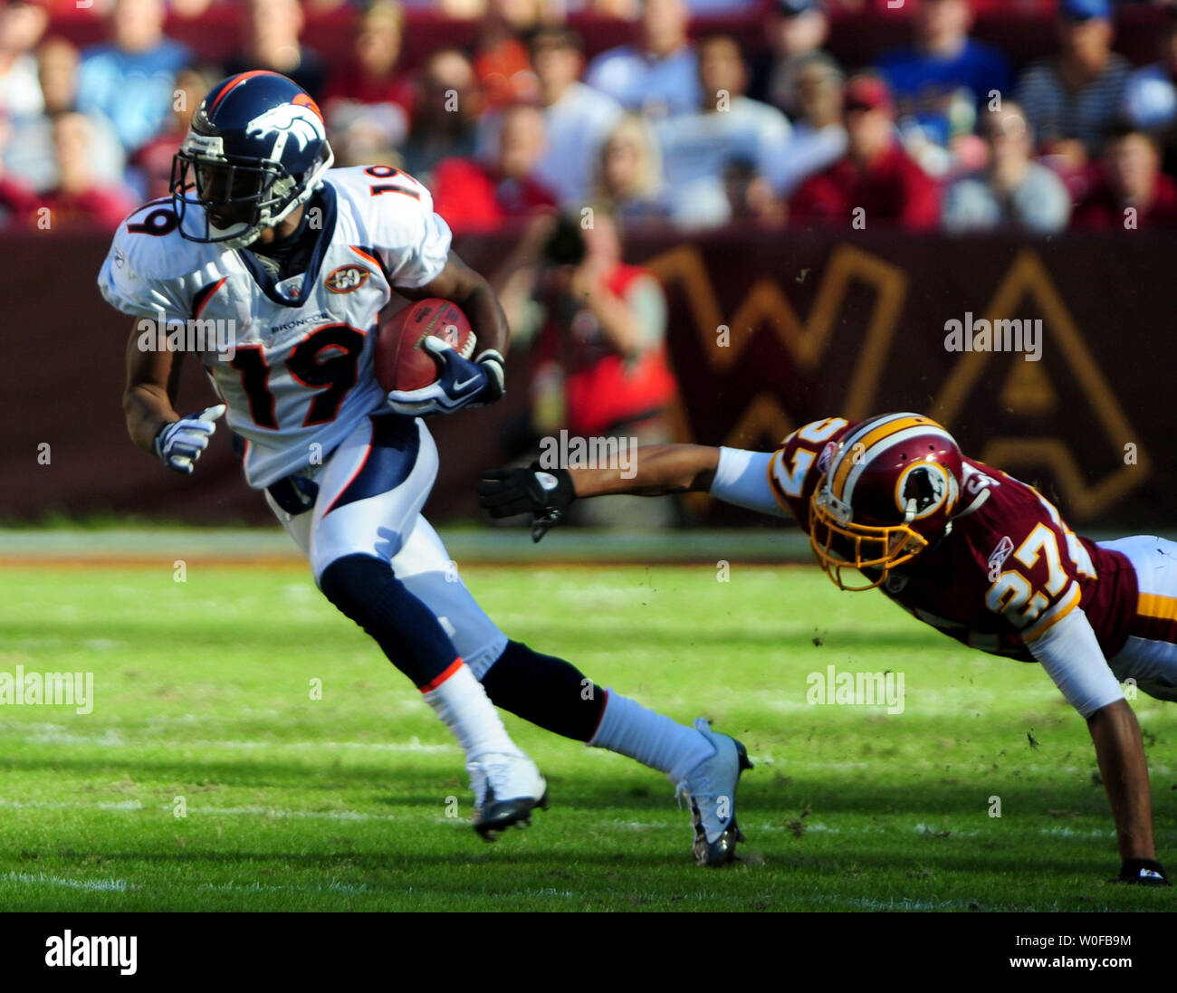 Denver Broncos wide receiver Eddie Royal runs for a first down against  Washington Redskins Red Smoot during the second quarter at FedEx Field in  Landover, Maryland on November 15, 2009. UPI/Kevin Dietsch, image size:1300x1097