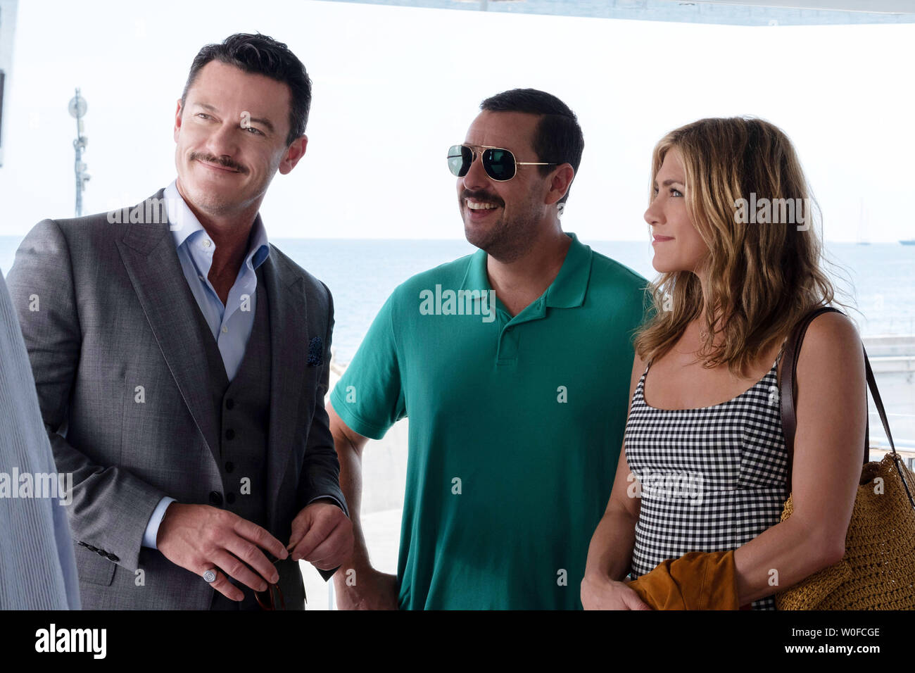 MURDER MYSTERY, from left Luke Evans, Adam Sandler, Jennifer Aniston