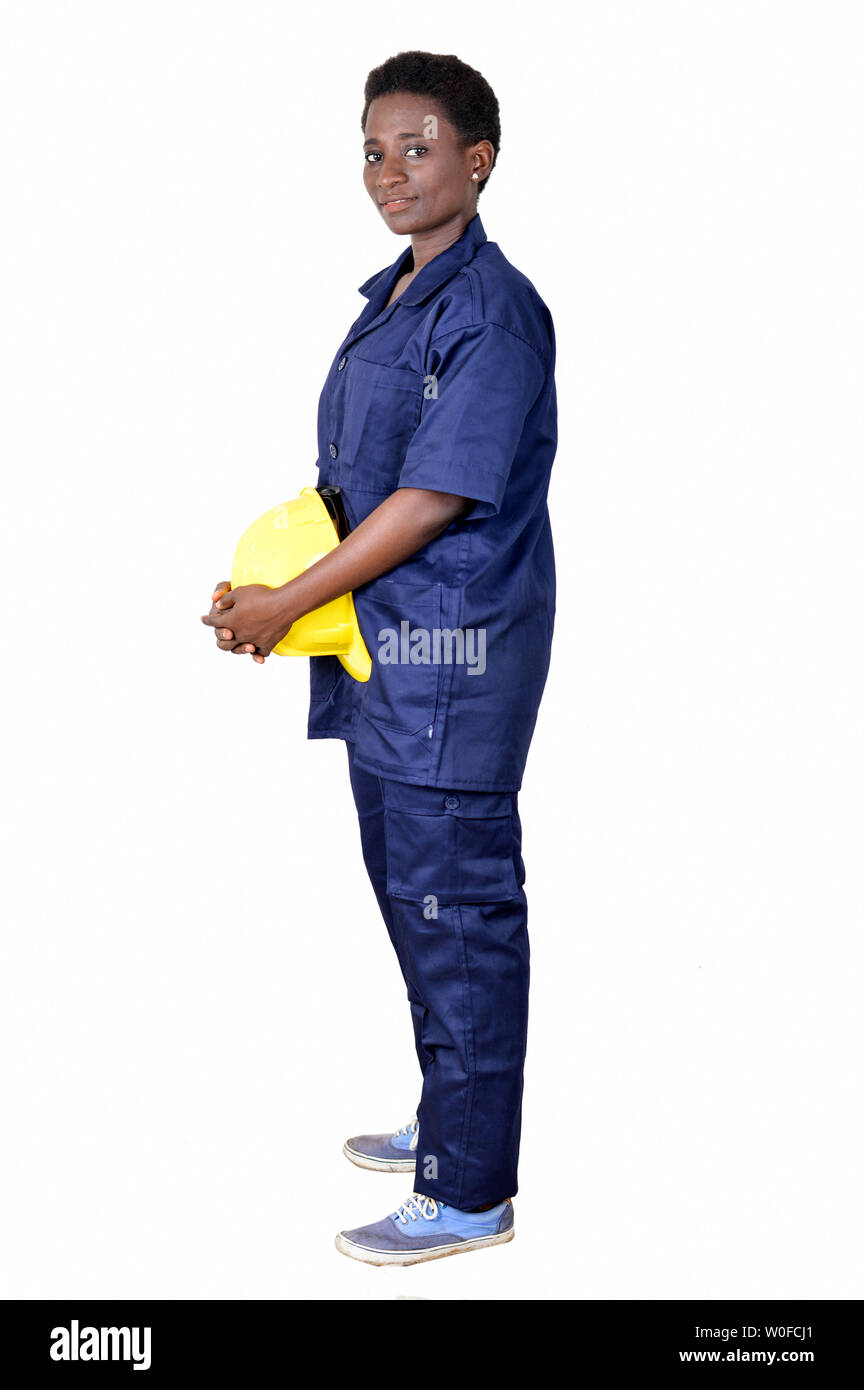 Young construction worker holding his helmet on a white background. Stock Photo