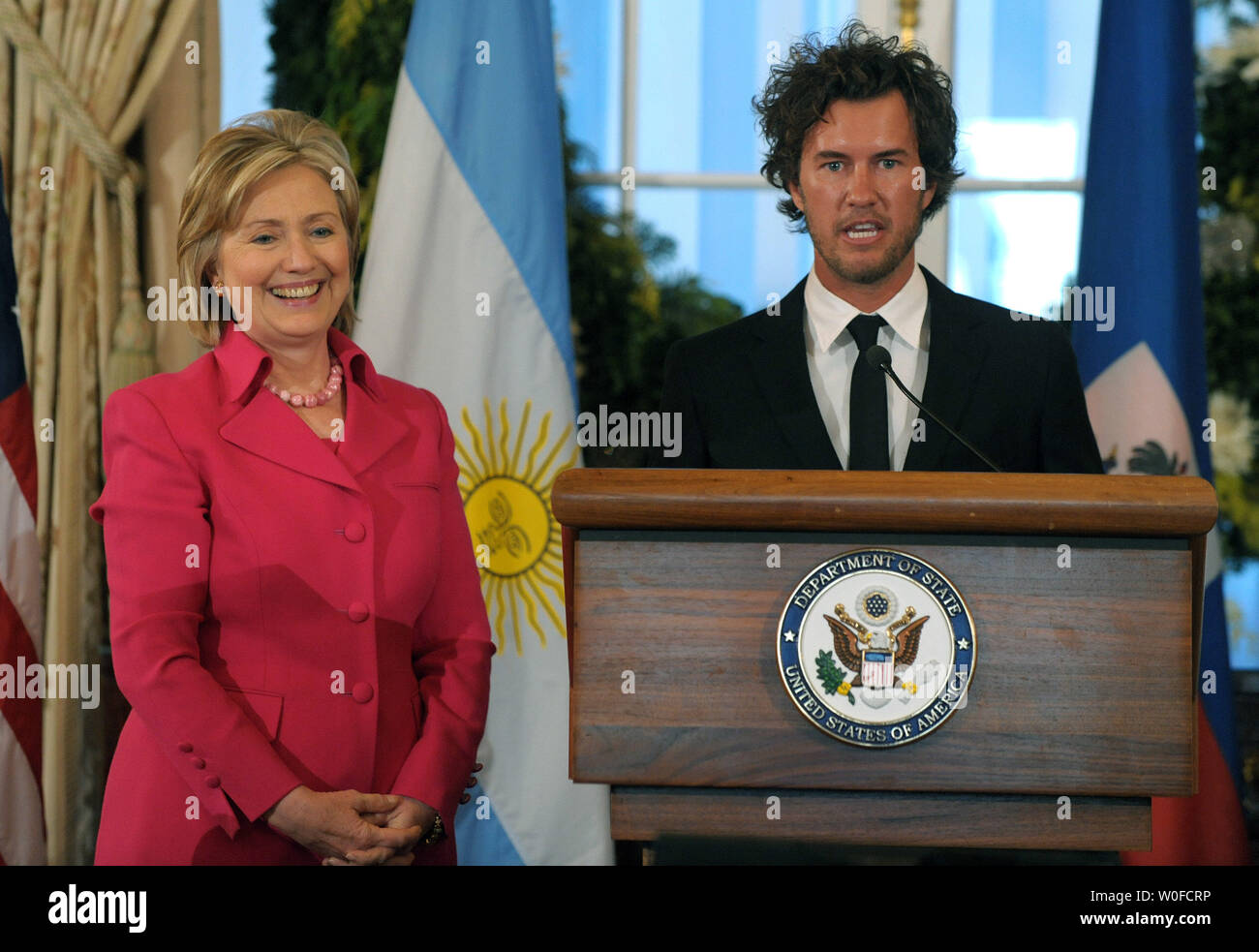 Secretary of State Hillary Rodham Clinton listens as Blake