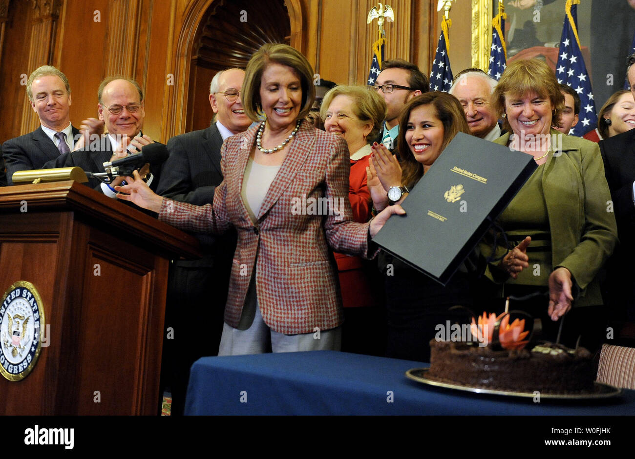 Speaker of the House Nancy Pelosi, D-CA, looks at her birthday cake after she signed the House Health Care and Education Reconciliation Act after it was passed by the Senate on Capitol Hill in Washington on March 26, 2010. The bill, sometimes referred to as the House 'fix' for the overall health care reform bill passed by the Senate earlier this week, will now go to U.S. President Barack Obama for his signature.    UPI/Roger L. Wollenberg Stock Photo