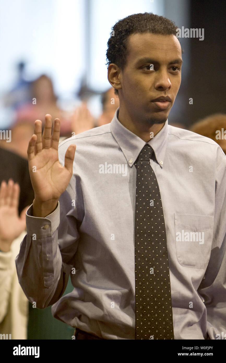 Robel Tsehai from Ethiopia takes the Oath of Allegiance during a naturalization ceremony commemorating the 30th anniversary of the Refugee Resettlement Act of 1980. 27 new citizens from Egypt, Ethiopia, Iran, Pakistan, Philippines, Sierra Leone, Somalia, Sudan and Vietnam took the Oath of Allegiance in Washington on March 30, 2010.      UPI/Madeline Marshall Stock Photo