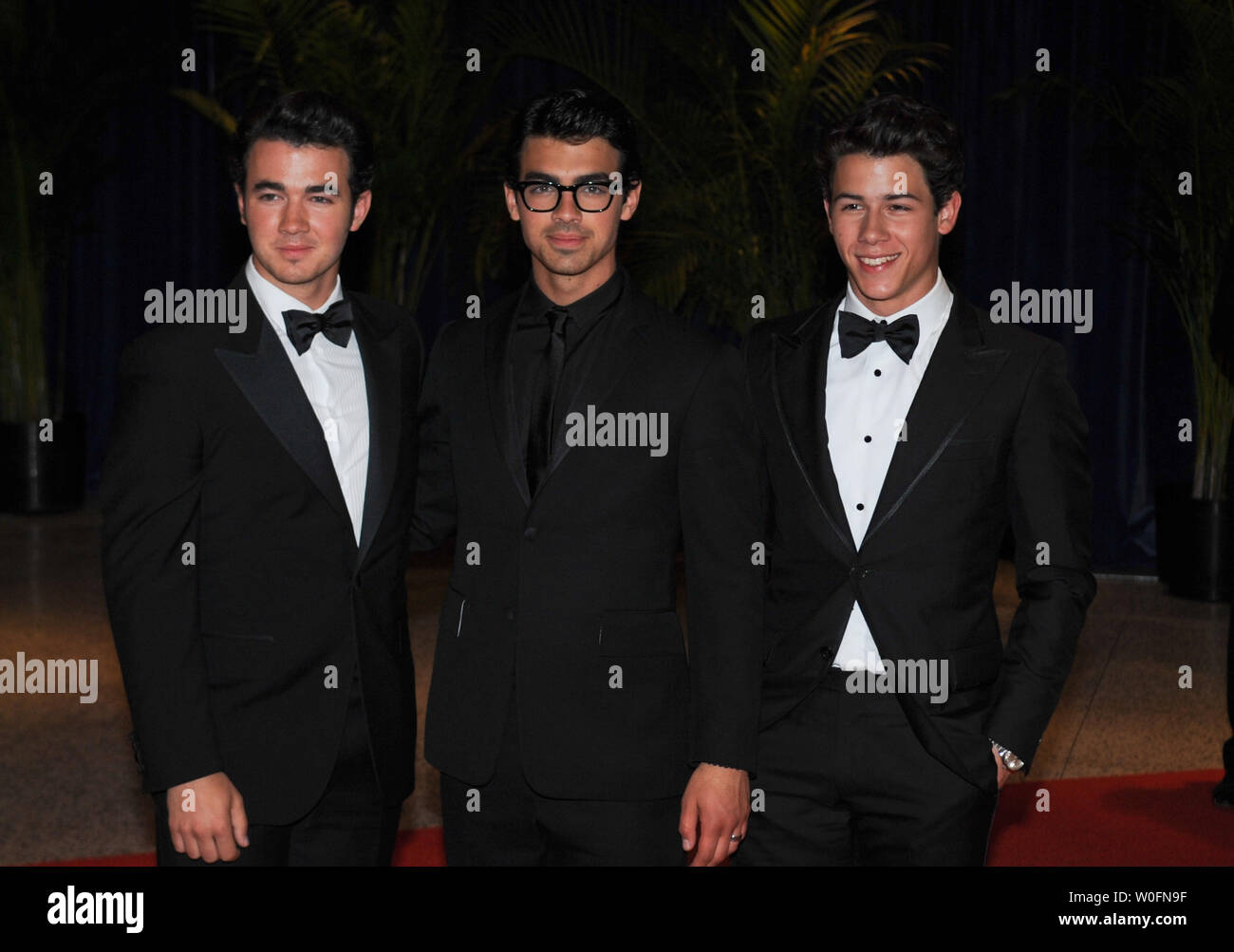 (L to R) Kevin, Joe and Nick Jonas, of the Jonas Brothers arrive at the White House Correspondents Dinner in Washington on May 1, 2010. UPI/Alexis C. Glenn Stock Photo