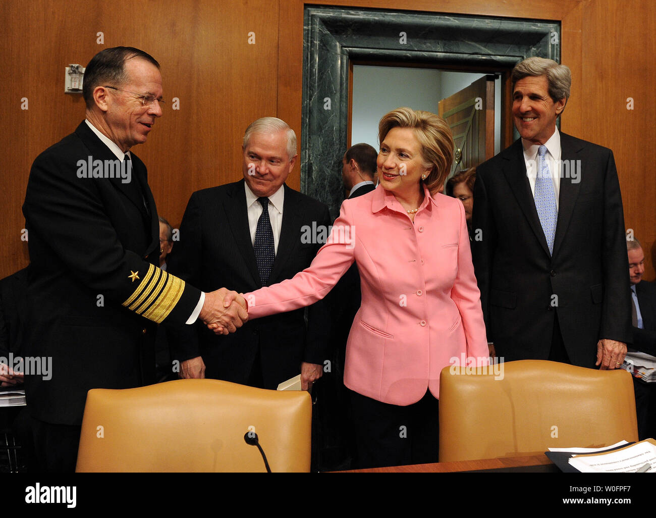 Secretary of State Hillary Rodham Clinton shakes hands with Chairman of the Joint Chiefs of Staff Adm. Michael Mullen as Secretary of Defense Robert Gates and Sen. John Kerry, D-MA, look on before the Senate Foreign Relations Committee regarding the new START treaty on Capitol Hill in Washington on May 18, 2010. The Strategic Arms Reduction Treaty (START) between the U.S. and Russia, aimed at reducing nuclear arms, was signed in Prague on April 8, 2010.   UPI/Roger L. Wollenberg Stock Photo