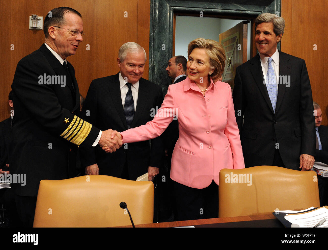 Secretary of State Hillary Rodham Clinton shakes hands with Chairman of the Joint Chiefs of Staff Adm. Michael Mullen as Secretary of Defense Robert Gates and Sen. John Kerry, D-MA, look on before the Senate Foreign Relations Committee regarding the new START treaty on Capitol Hill in Washington on May 18, 2010. The Strategic Arms Reduction Treaty (START) between the U.S. and Russia, aimed at reducing nuclear arms, was signed in Prague on April 8, 2010.   UPI/Roger L. Wollenberg Stock Photo