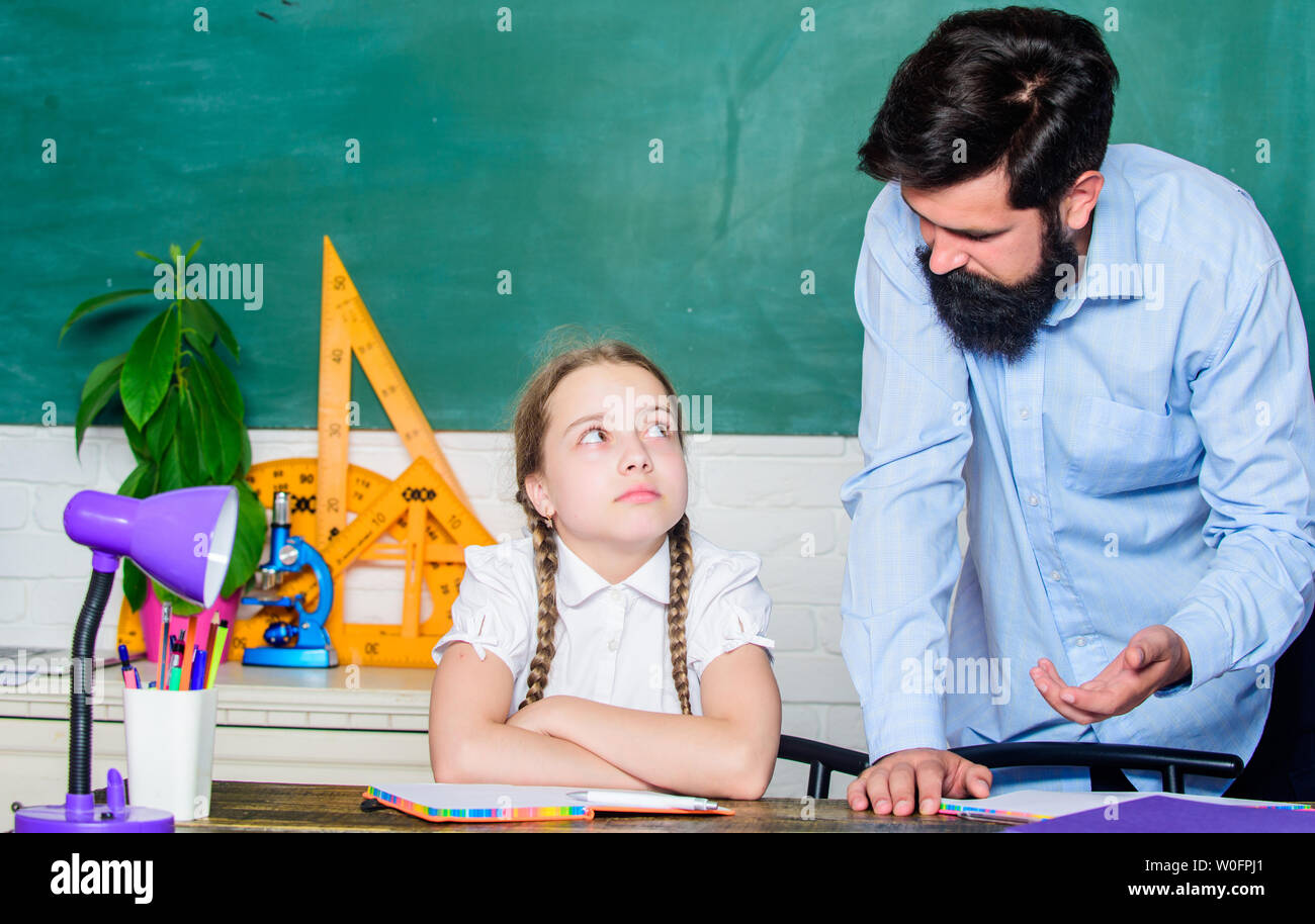 help and support. education child development. daughter study with father. Teachers day. bearded man teacher with small girl in classroom. back to school. knowledge day. Home schooling. Stock Photo