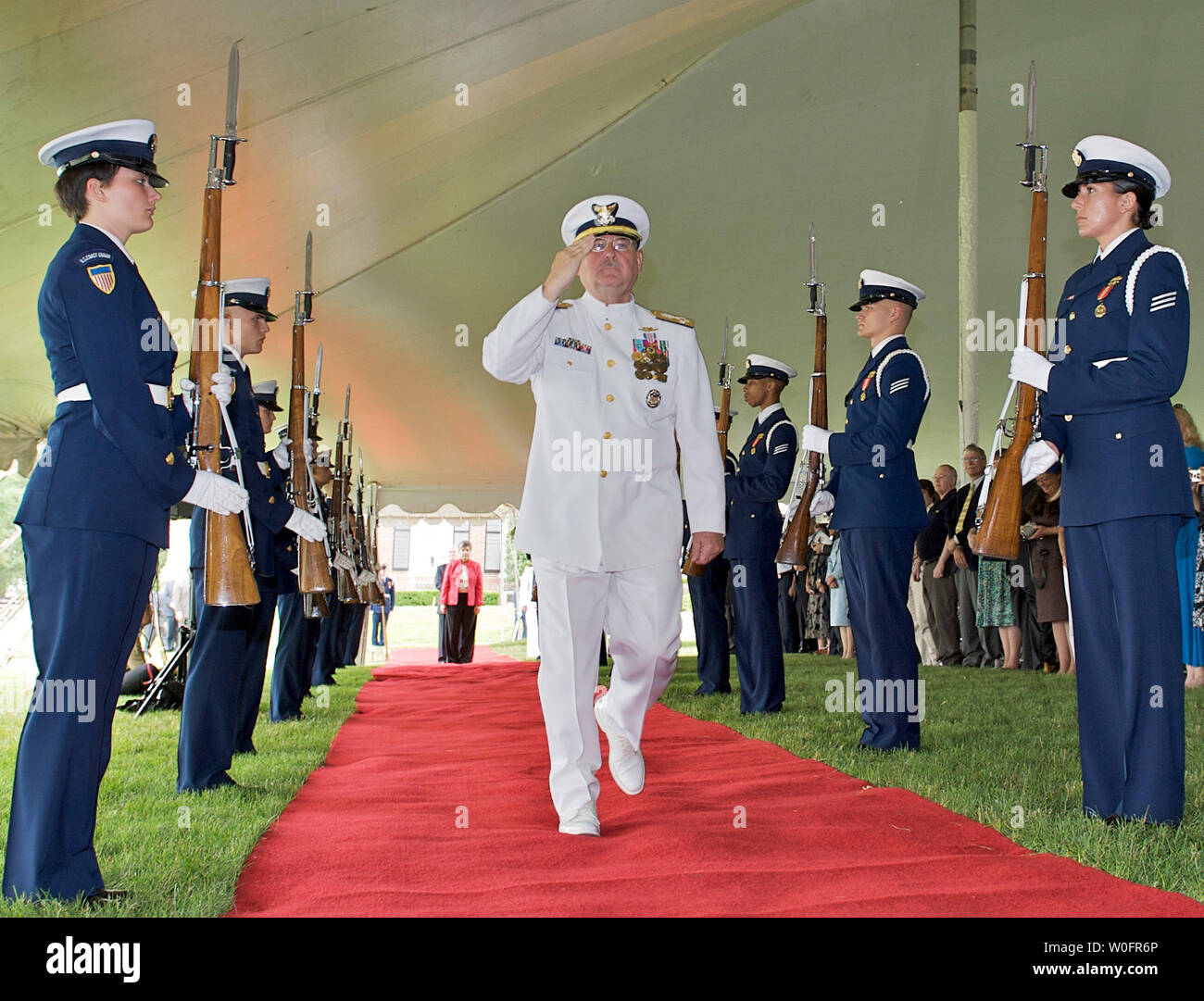 Outgoing Coast Guard Commandant Adm. Thad W. Allen salutes the flag as he enters his change of command ceremony at Ft. McNair in Washington on May 25, 2010. Adm. Robert J. Papp Jr., relieved Allen and assumed command as Commandant of the Coast Guard.  UPI/Isaac Pacheco Stock Photo