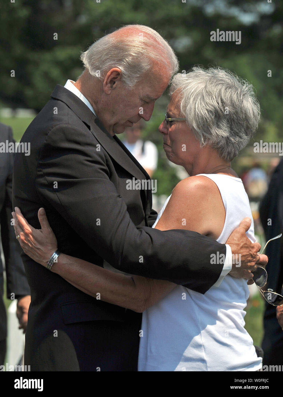 Vice President Joe Biden embraces Susan van Aalten , whose son Army Sgt. Alexander van Aalten was killed while serving in Afghanistan, in section 60 at Arlington National Cemetery in Arlington, Virginia on Memorial Day, May 31, 2010.   UPI/Kevin Dietsch Stock Photo