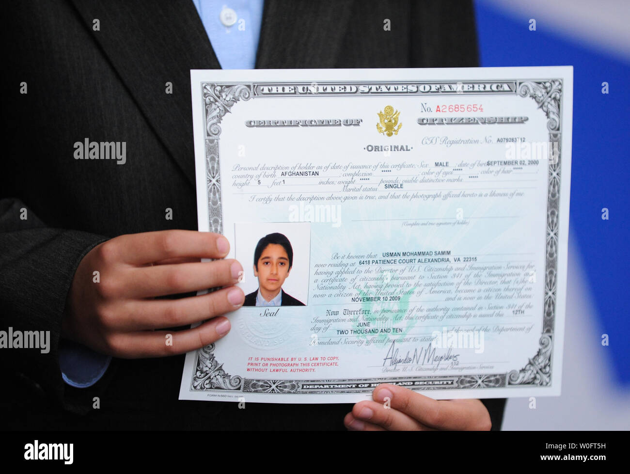 Usman Mohammad Samin Born In Afghanistan Holds His Certificate Of usman-mohammad-samin-born-in-afghanistan-holds-his-certificate-of