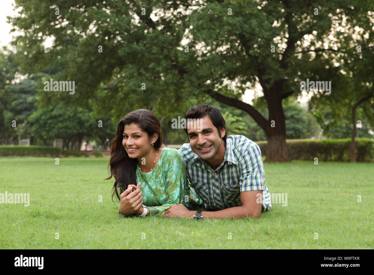 Indian couple romancing in park hi-res stock photography and images - Alamy
