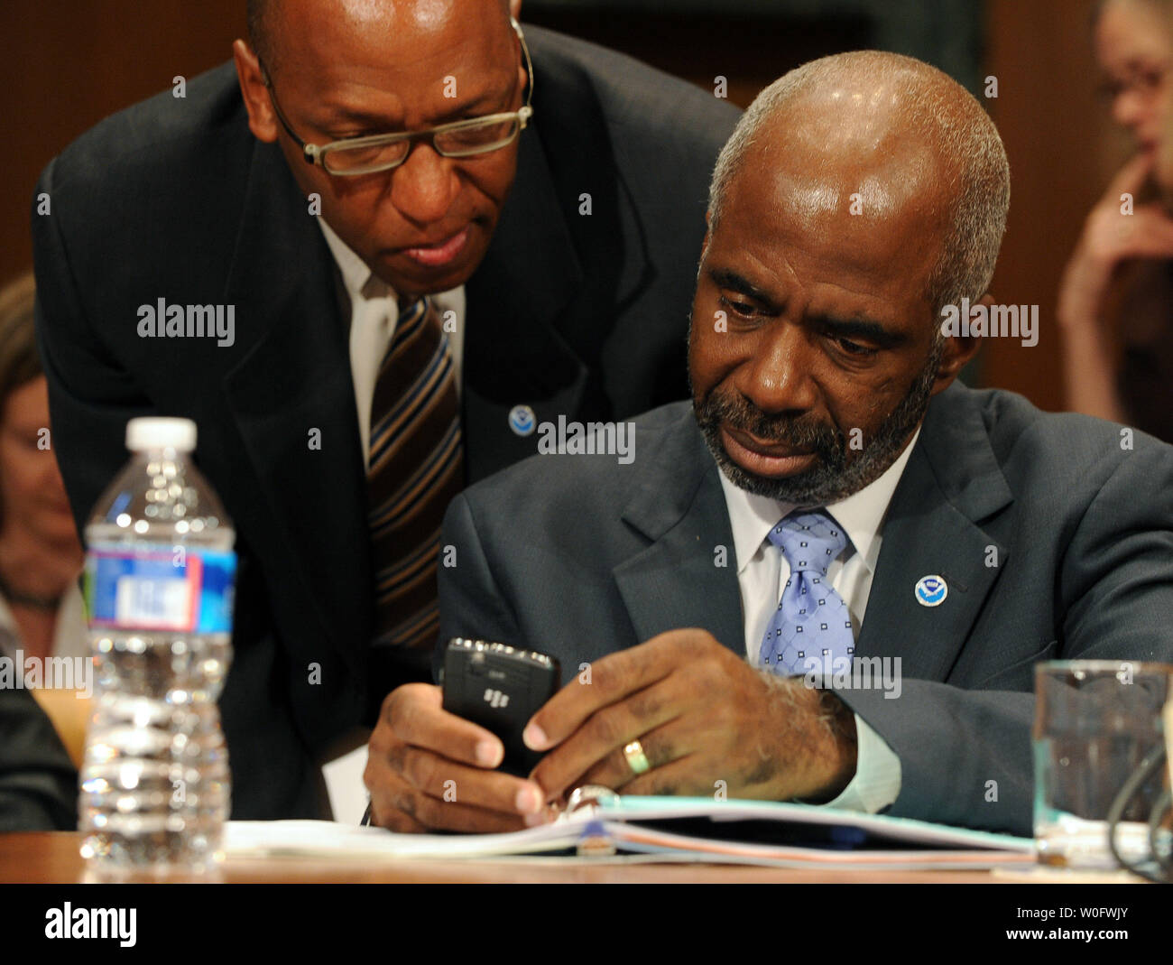 Assistant Commerce Secretary for Oceans and Atmosphere Larry Robinson of the National Oceanic and Atmospheric Administration (NOAA) (R) speaks with an aide prior to testifying before the Senate Appropriations Committee Commcer, Justice, Science and Related Agencies Subcommittee regarding the use of dispersants in response to the Deepwater Horizon oil spill on Capitol Hill in Washington on July 15, 2010.    UPI/Roger L. Wollenberg Stock Photo