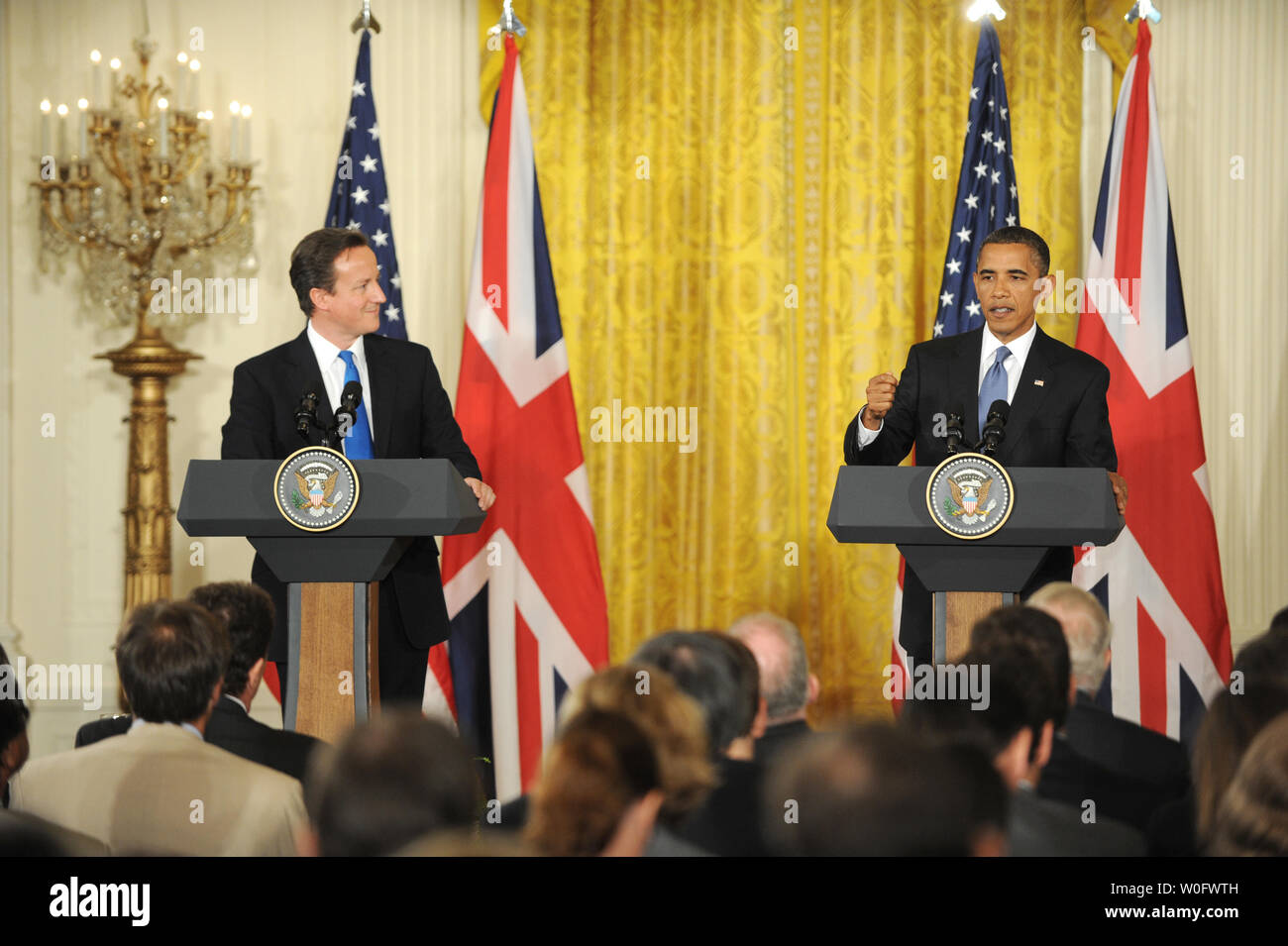 United States President Barack Obama (R) and British Prime Minister David Cameron hold a joint press conference in the East Room of the White House in Washington on July 20, 2010.  Cameron is making his first visit to the United States 10 weeks after taking office.     UPI/Pat Benic Stock Photo