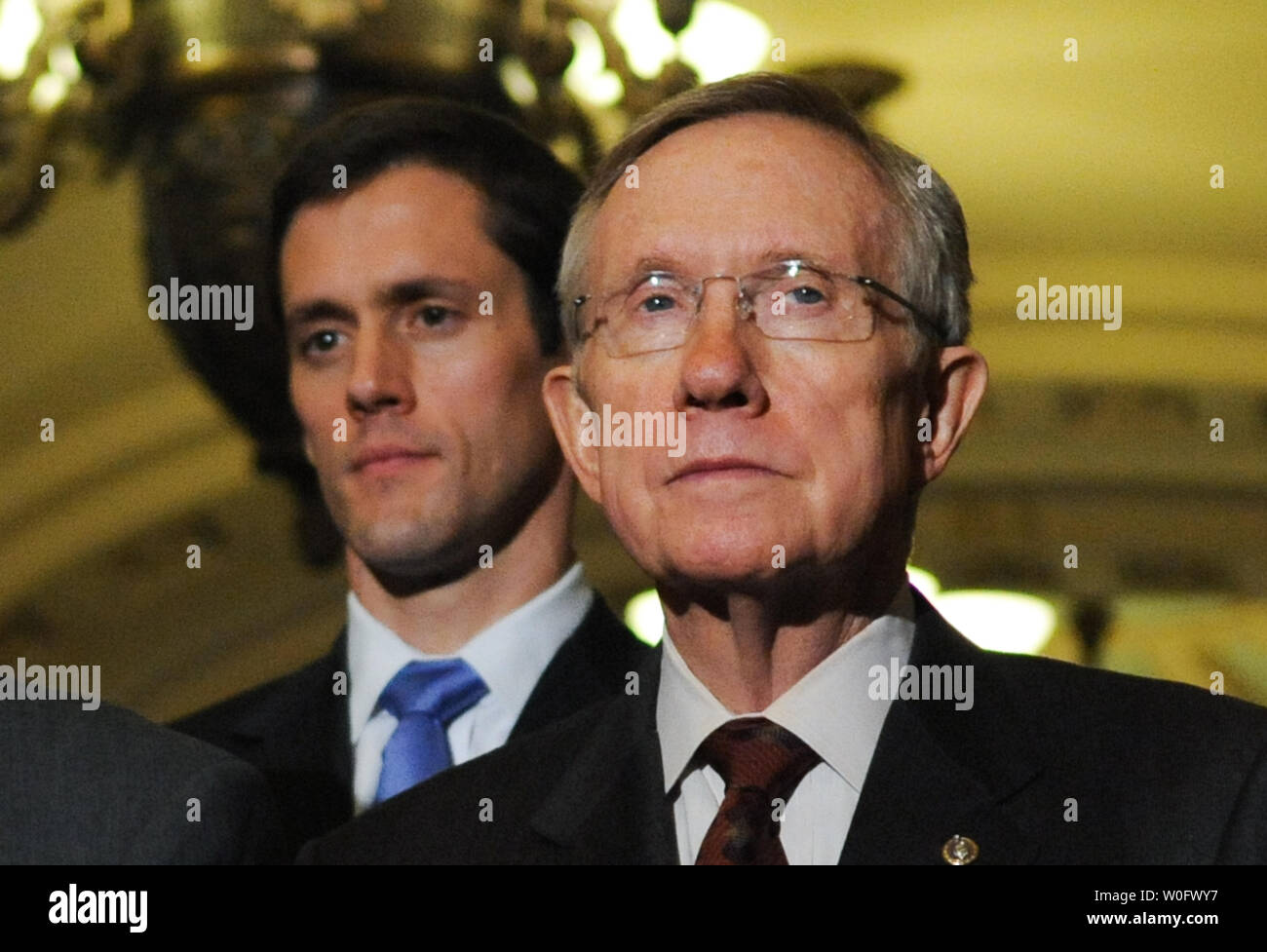 Senate Majority Leader Harry Reid (D-NV) (R) and Sen. Carte Goodwin (D-WV) (2nd R) sworn-in today to replace the late Sen. Robert Byrd, attend a press conference after the Senate voted 60-40 to approve an extension of unemployment benefits on Capitol Hill in Washington on July 20, 2010. UPI/Alexis C. Glenn Stock Photo