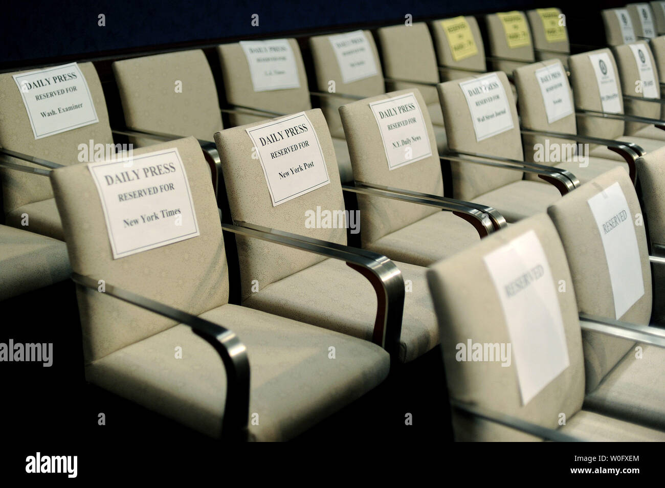 Chairs Reserved For Various News Outlets Including A Row