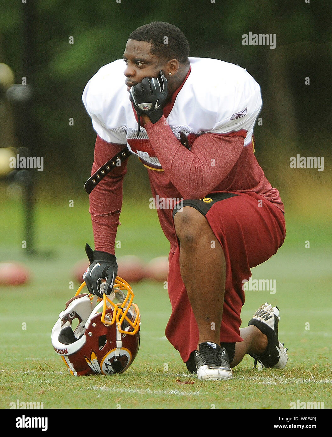 Washington Redskins running back Clinton Portis watches as play are run  during practice at Redskins Park in Ashburn, Virginia, on August 5, 2010.  UPI/Roger L. Wollenberg Stock Photo - Alamy