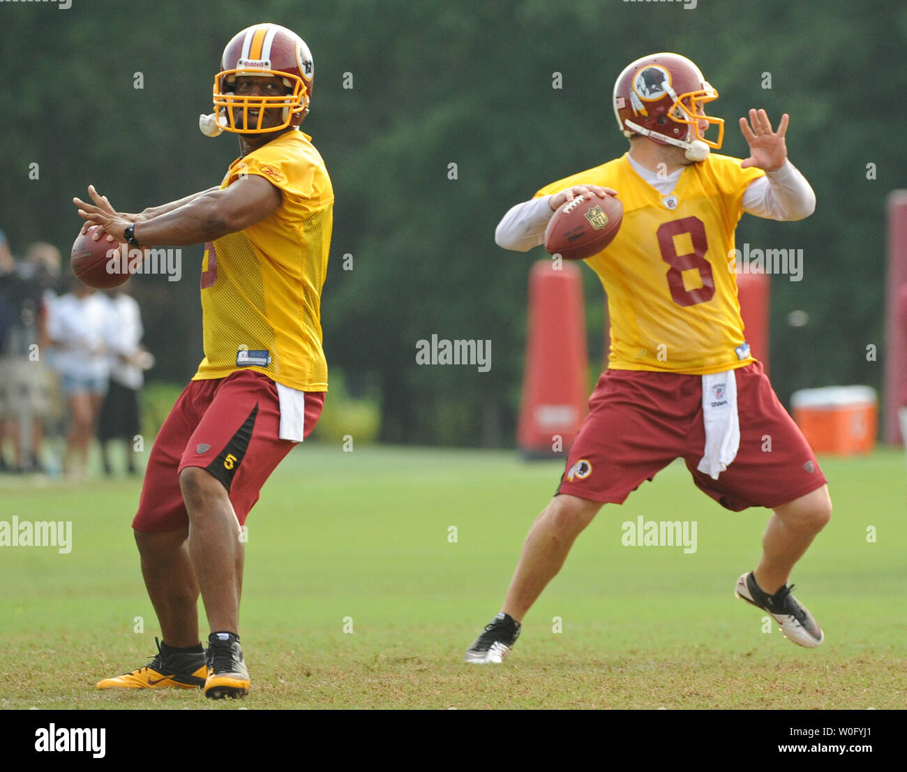 Washington Redskins quarterbacks Donovan McNabb (L) and Rex Grossman participate in a drill during the last day of Redskins training camp at Redskins Park in Ashburn, Virginia, August 19, 2010. UPI/Kevin Dietsch Stock Photo