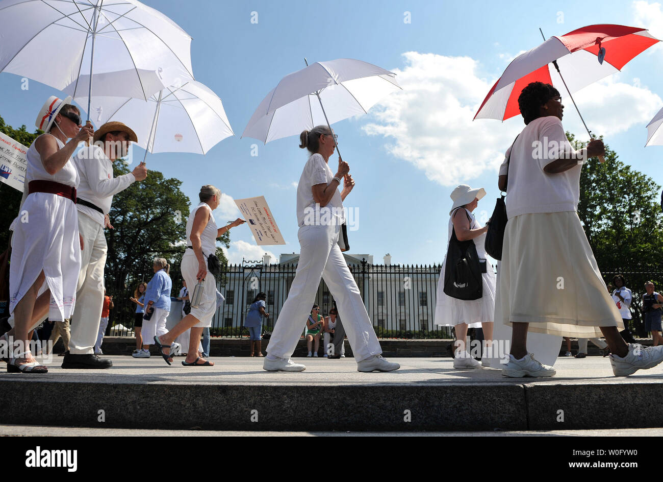 Members and supporters of the League of Women Voters and DC Vote hold a demonstration to protest the lack of voting rights for the citizens of Washington, D.C., on the 90th Anniversary of the 19th Amendment, guaranteeing women the right to vote, in front of the White House in Washington on August 26, 2010.   UPI/Kevin Dietsch Stock Photo