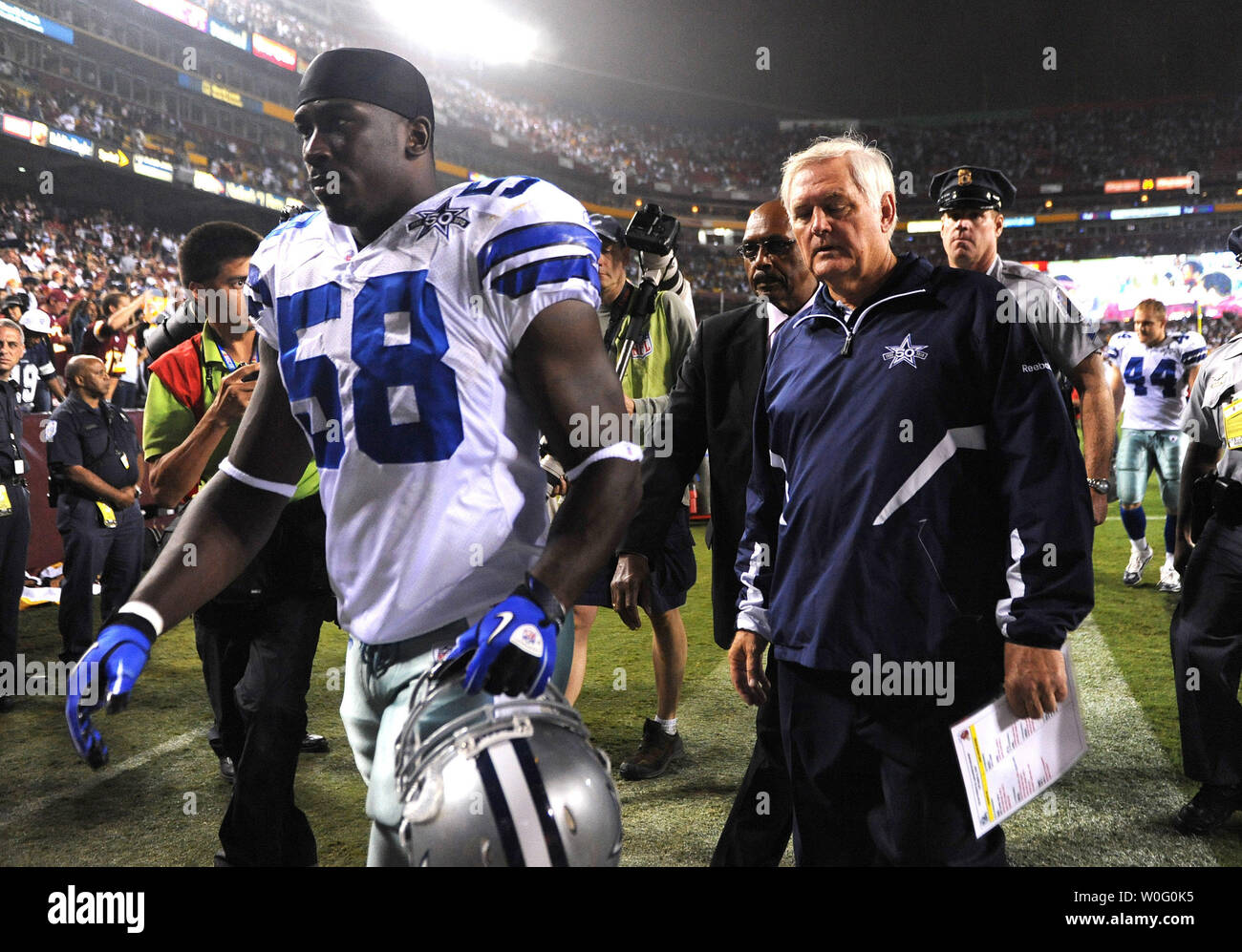 Dallas Cowboys' head coach Wade Phillips and linebacker Jason Williams leave the field after the Cowboys were defeated by Washington Redskins 13-7 at FedEx Field in Landover, Maryland on September 12, 2010.  UPI/Kevin Dietsch Stock Photo