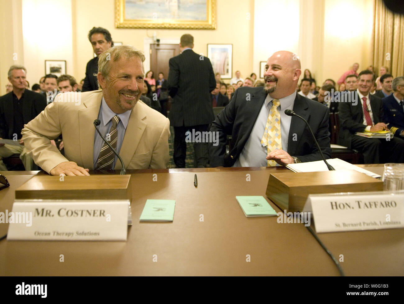 Actor Kevin Costner (L) talks to  Craig Paul Taffaro Jr., President of St. Bernard Parish, LA, prior to testifying during a House Homeland Security Committee hearing on 'DHS Planning and Response: Preliminary Lessons from the Deepwater Horizon,' in Washing on September 22, 2010.   UPI/Kevin Dietsch Stock Photo