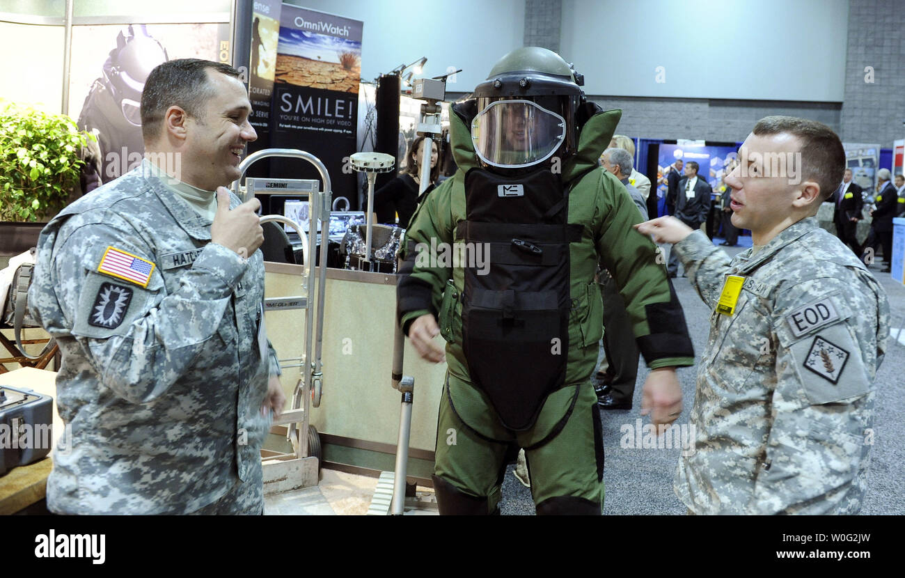 Explosive Ordinance Disposal (EOD) team members look over an EOD suit at the US Army Exposition in Washington on October 26, 2010.     UPI/Roger L. Wollenberg Stock Photo