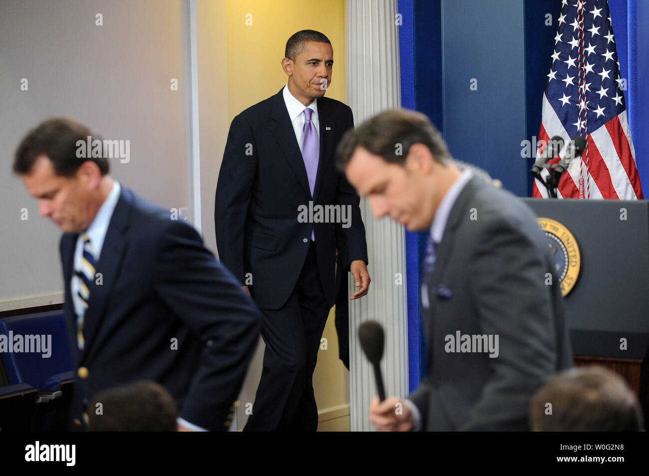 Reporters take their seats as U.S. President Barack Obama arrives to make a statement regarding bomb material found on cargo planes in the Brady Press Briefing Room of the White House in Washington on October 29, 2010.       UPI/Roger L. Wollenberg Stock Photo