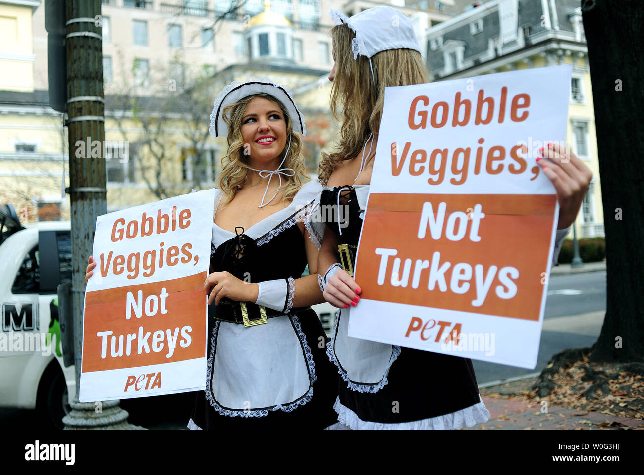 PETA activists Laura Chamberlin (L) and Monika Meilleur promote the eating of Tofurky, a tofu substitute to turkey, for Thanksgiving in front of the White House in Washington on November 23, 2010.   UPI/Kevin Dietsch Stock Photo