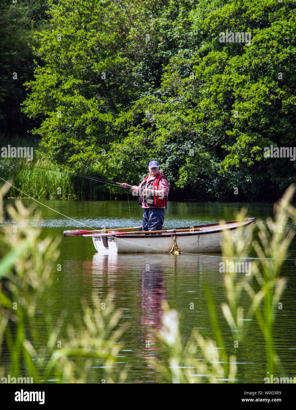 Man standing in a boat hi-res stock photography and images - Alamy
