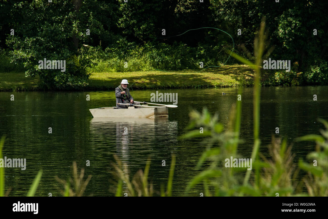 Man standing in a boat hi-res stock photography and images - Alamy
