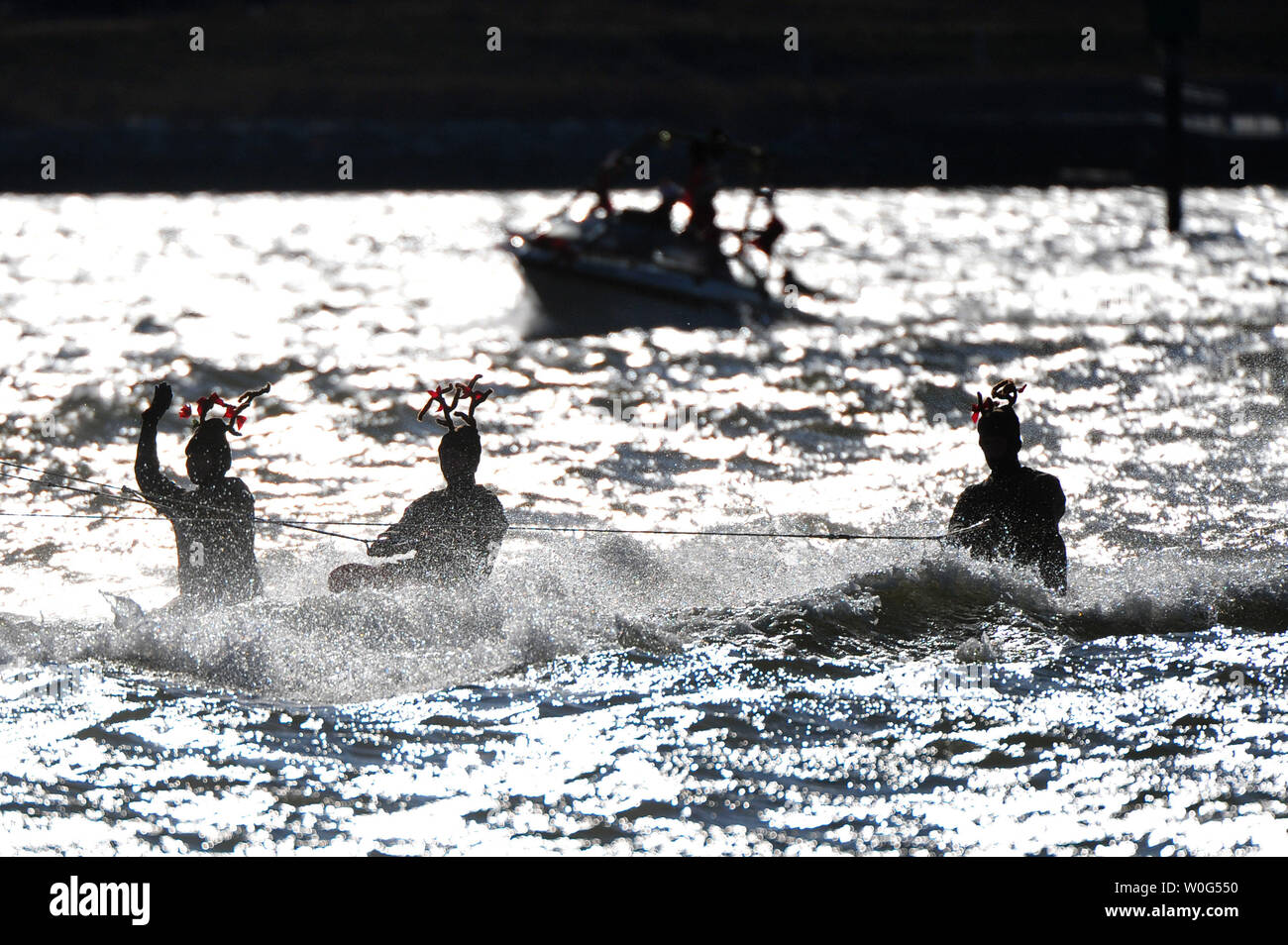 Kneeborders dressed as an reindeer perform during the 25th annual Water-Skiing Santa show on the Potomac River at the National Harbor in Maryland on December 24, 2010.   UPI/Kevin Dietsch Stock Photo