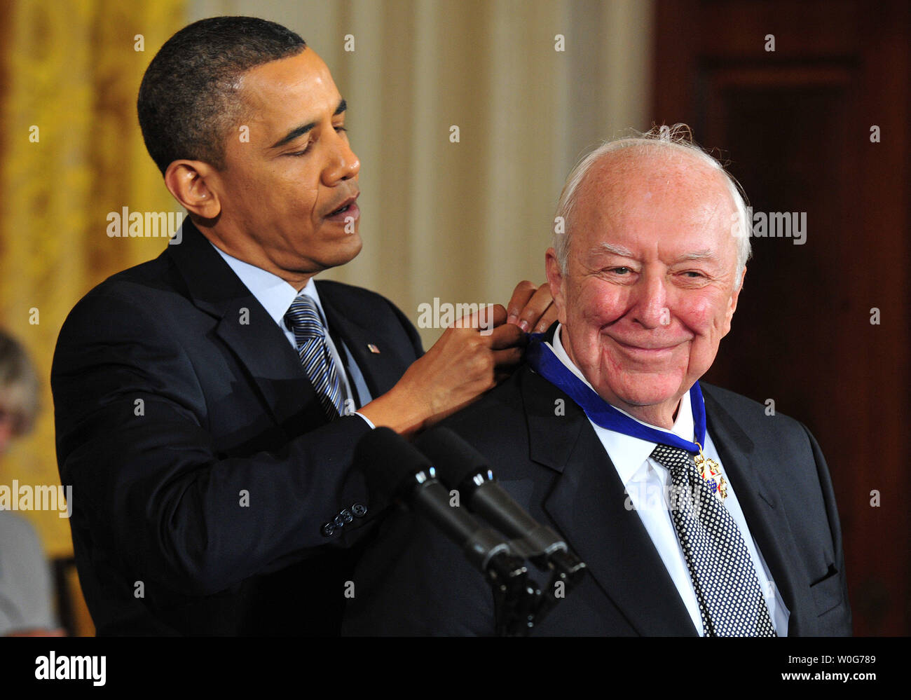 President Barack Obama awards the 2010 Presidential Medal of Freedom to artist Jasper Johns during a ceremony at the White House in Washington on February 15, 2011.  UPI/Kevin Dietsch Stock Photo
