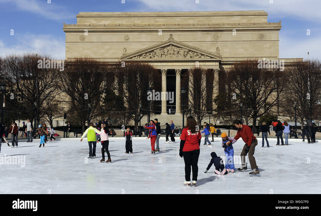 Ice Skaters Circle The Rink In The National Gallery Of Art