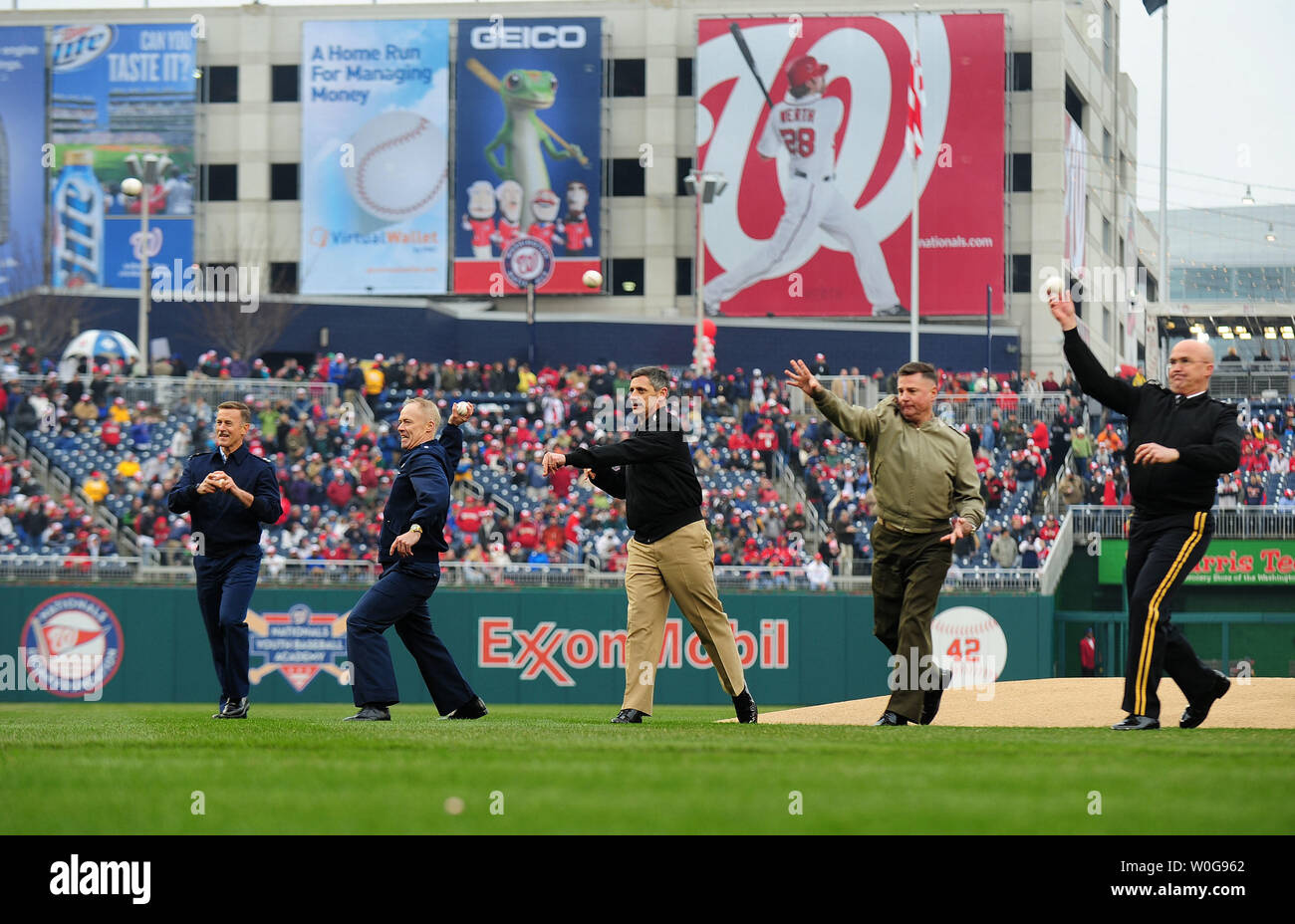Major General Karl Horst, U.S. Army, Lieutenant General Terry Robling, U.S. Marine Coprs, Vice Admiral Michael Vital, U.S. Navy, Lieutenant General Richard Newton III, U.S. Air Force, and Rear Admiral Paul Zukunft, U.S. Cost Guard, throw out the ceremonial first pitches prior to the Washington Nationals' opening day game against the Atlanta Braves at Nationals Park in Washington, March 31, 2011.  UPI/Kevin Dietsch Stock Photo